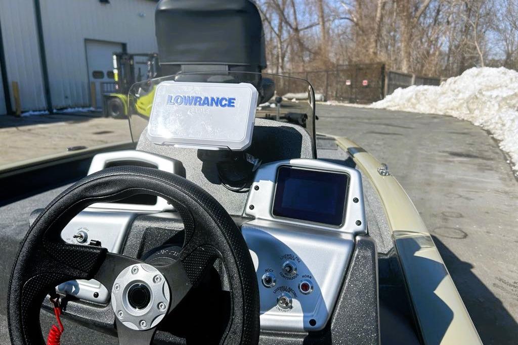 2026 Tracker Pro Team 175 boat dashboard with Lowrance electronics and steering wheel.