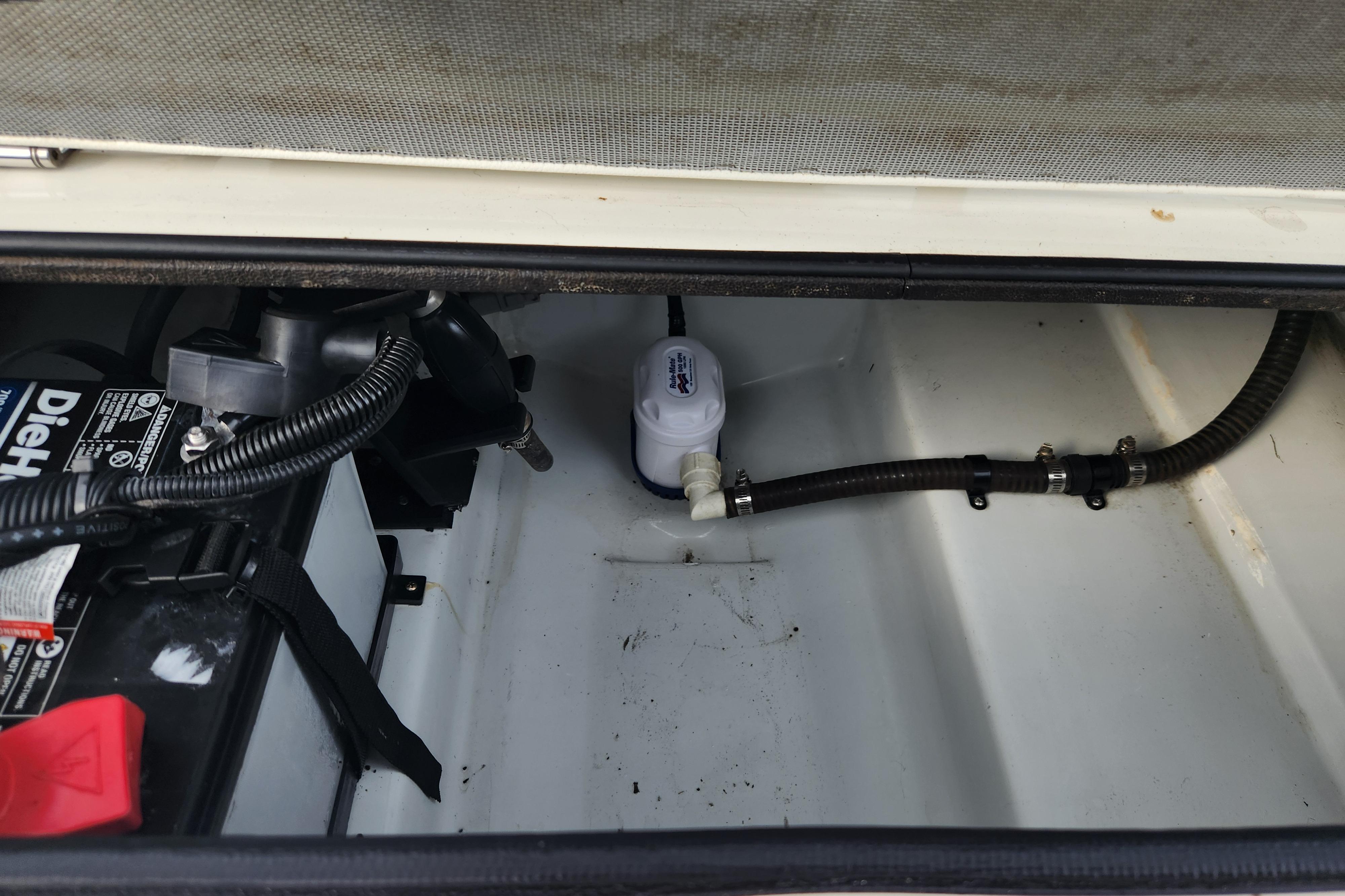 Battery compartment of 2019 Novurania DL 400 boat with wiring and pump.