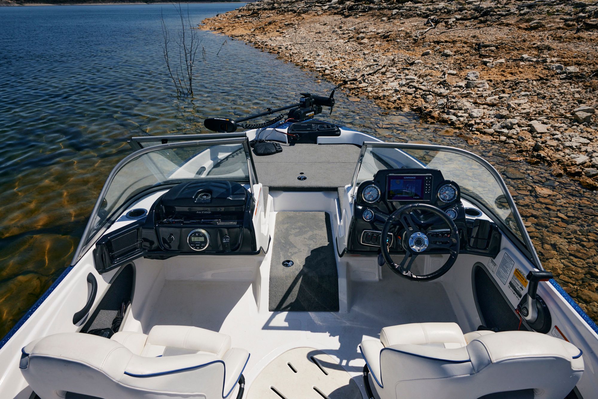 Interior of a 2020 Nitro Z19 Sport boat by the shore.