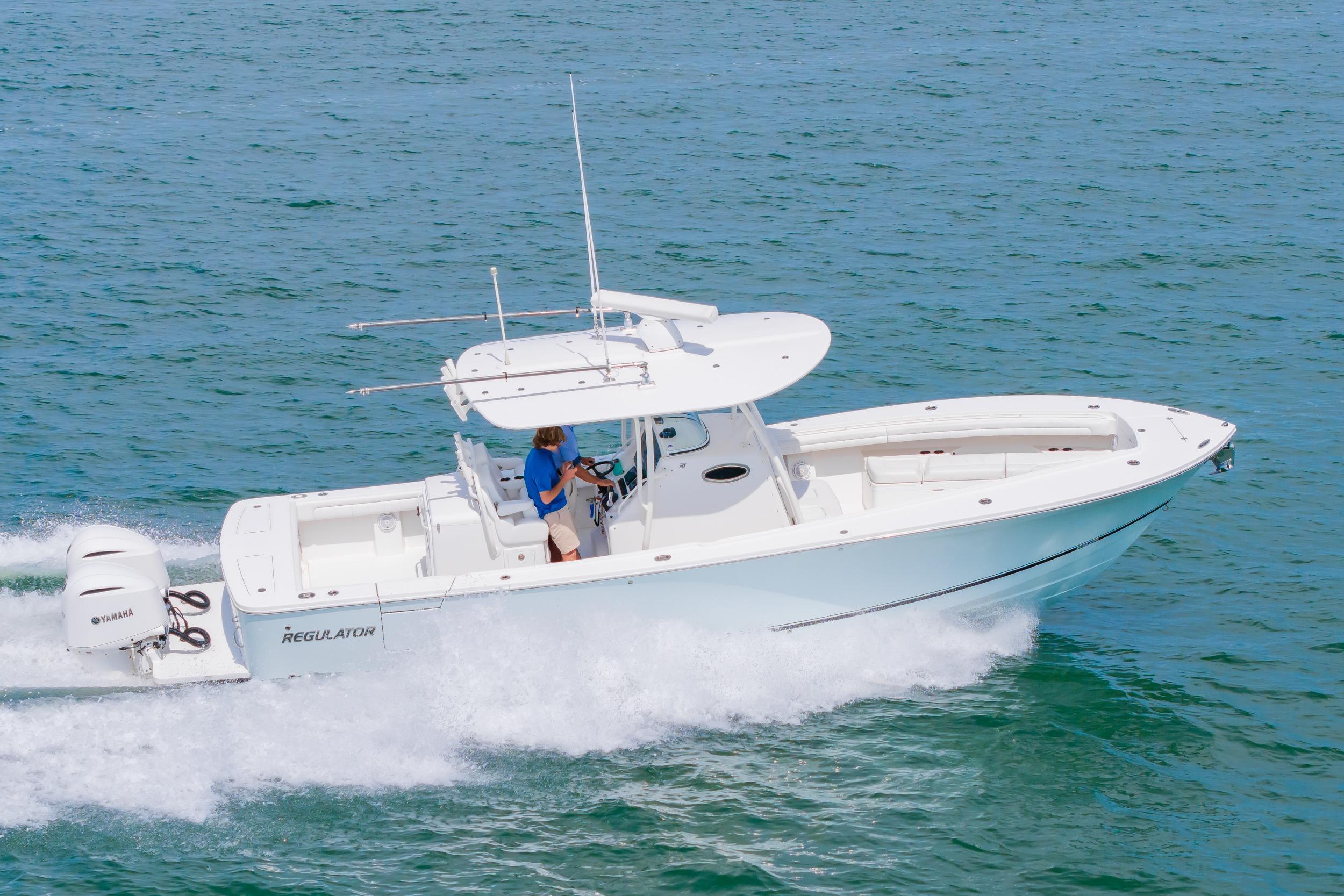 2019 Regulator 31 boat cruising on open water with Yamaha engines.