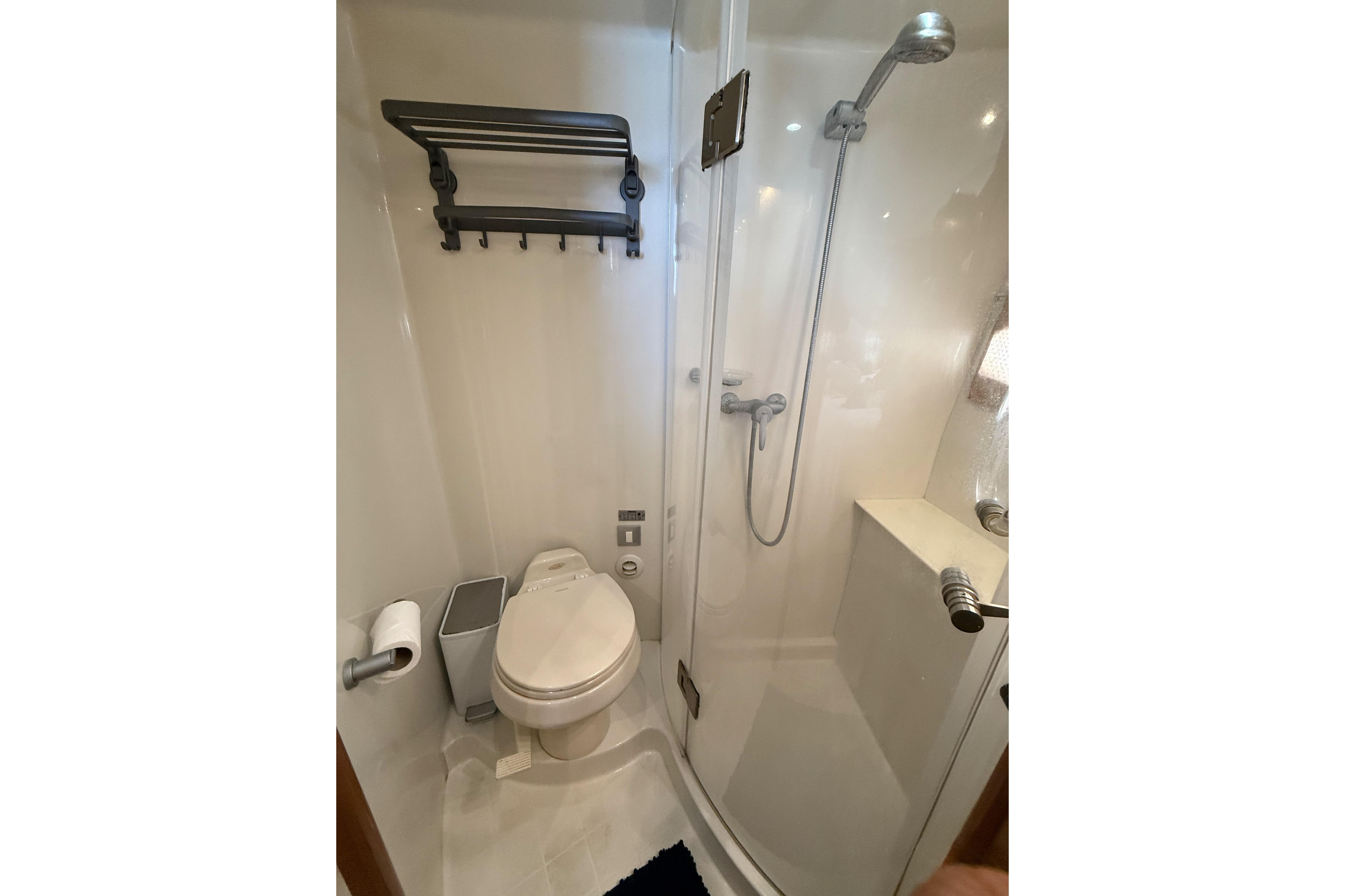 Bathroom interior of 2006 Carver 43 Motor Yacht with shower and toilet.