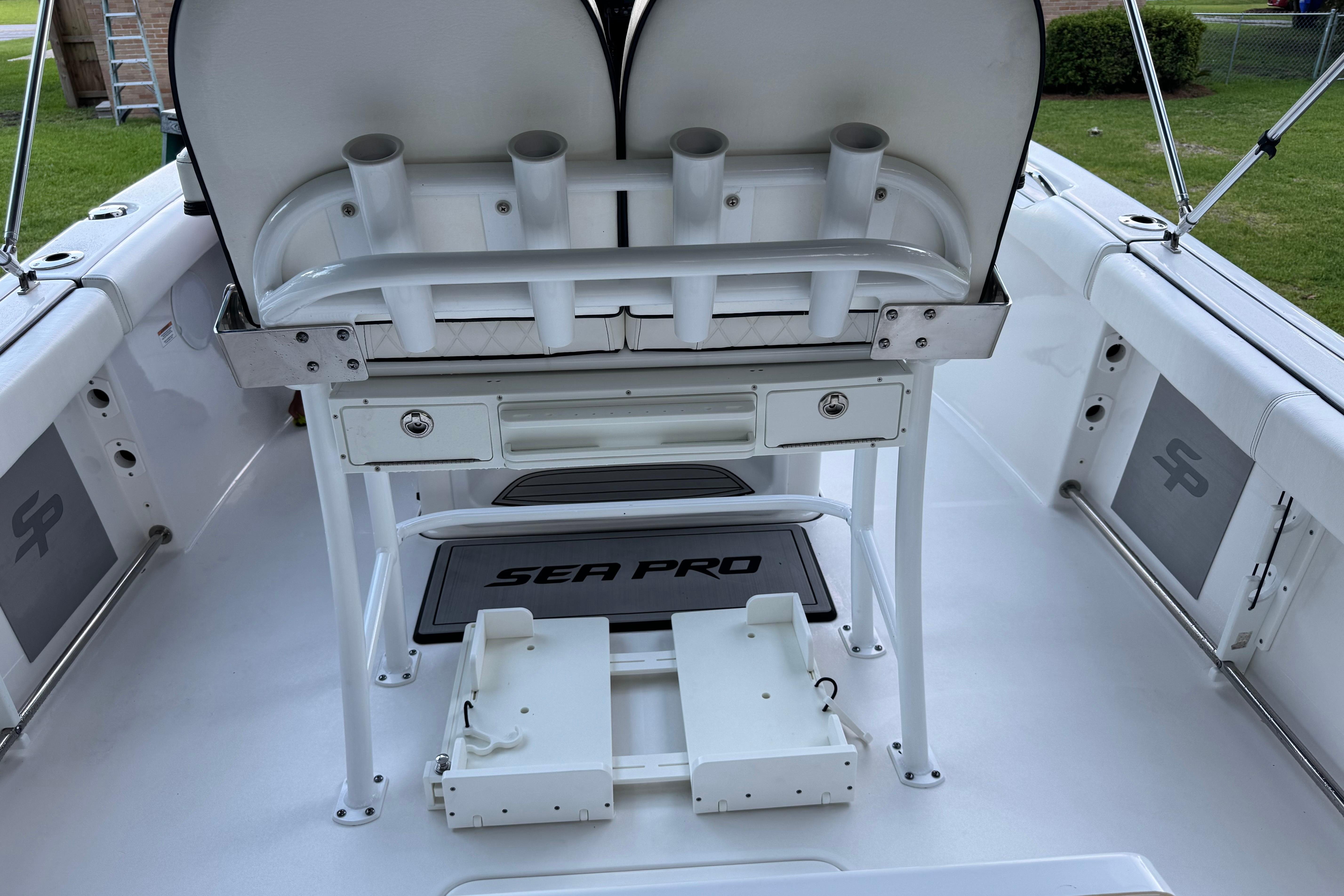 2022 Sea Pro 219 Center Console boat interior with rod holders and storage compartments.