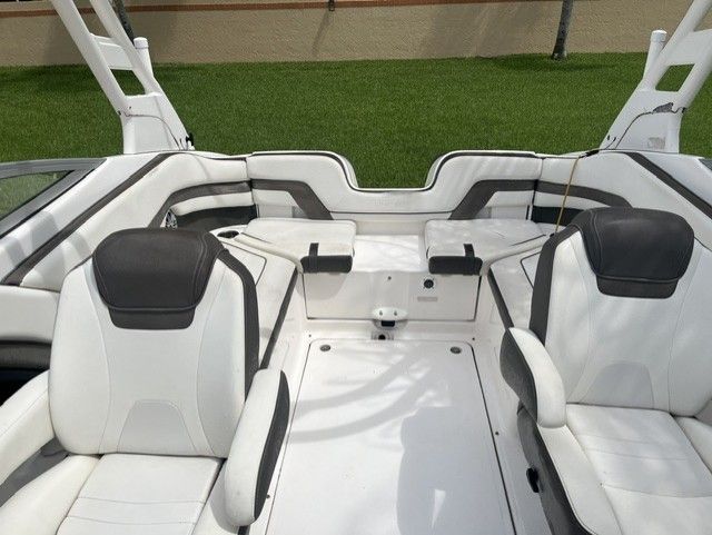 Interior of a 2015 Yamaha Boats 242 Limited S with white seating.