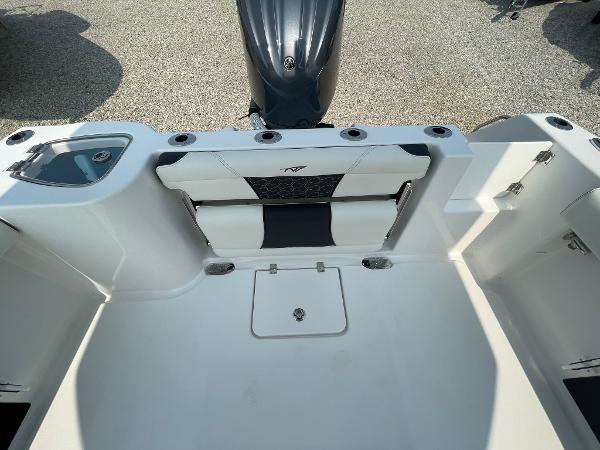2025 Tidewater 232 CC Adventure boat interior with seating and storage compartments.
