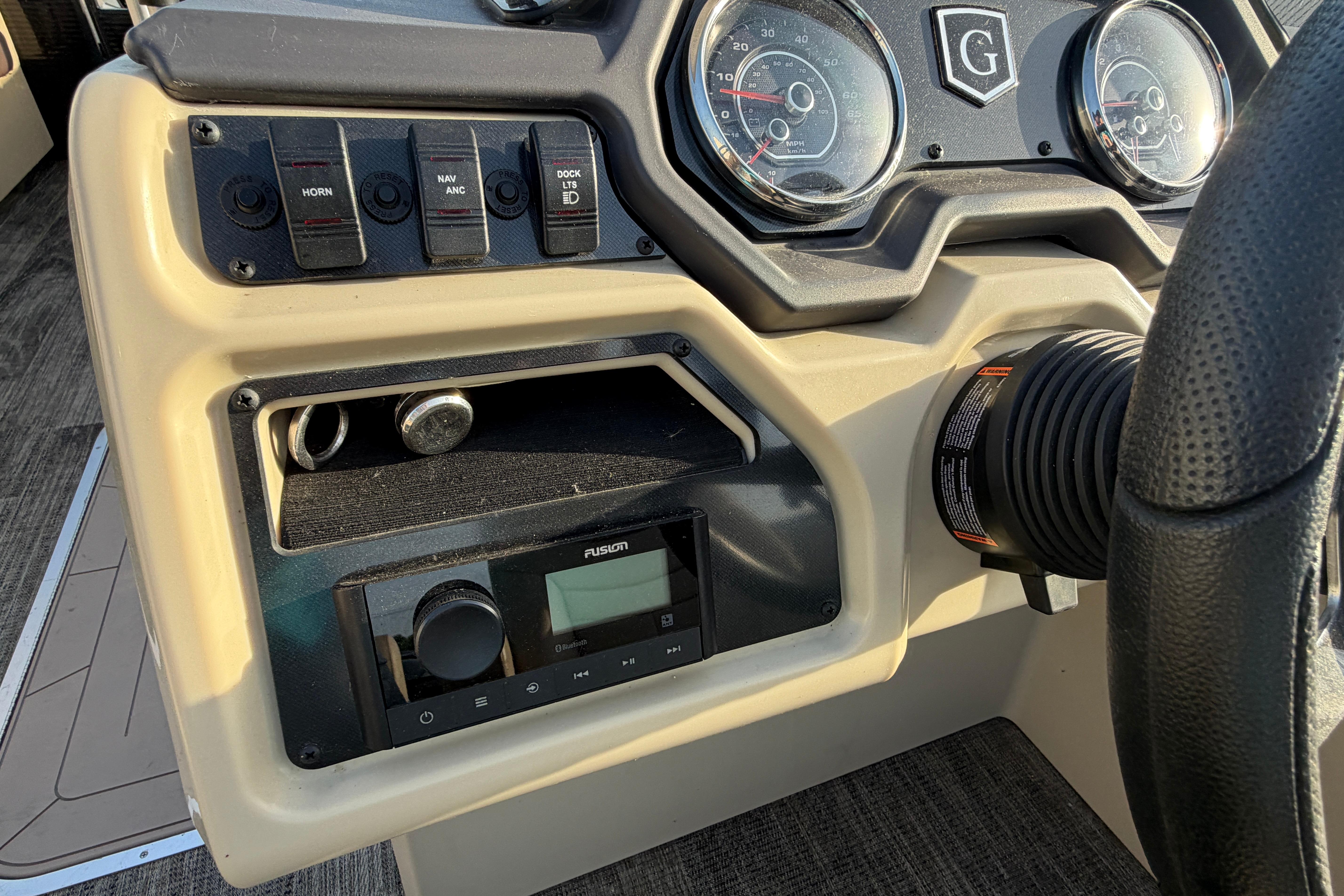 Dashboard of 2023 Godfrey Sweetwater 2286 C boat with controls and gauges.