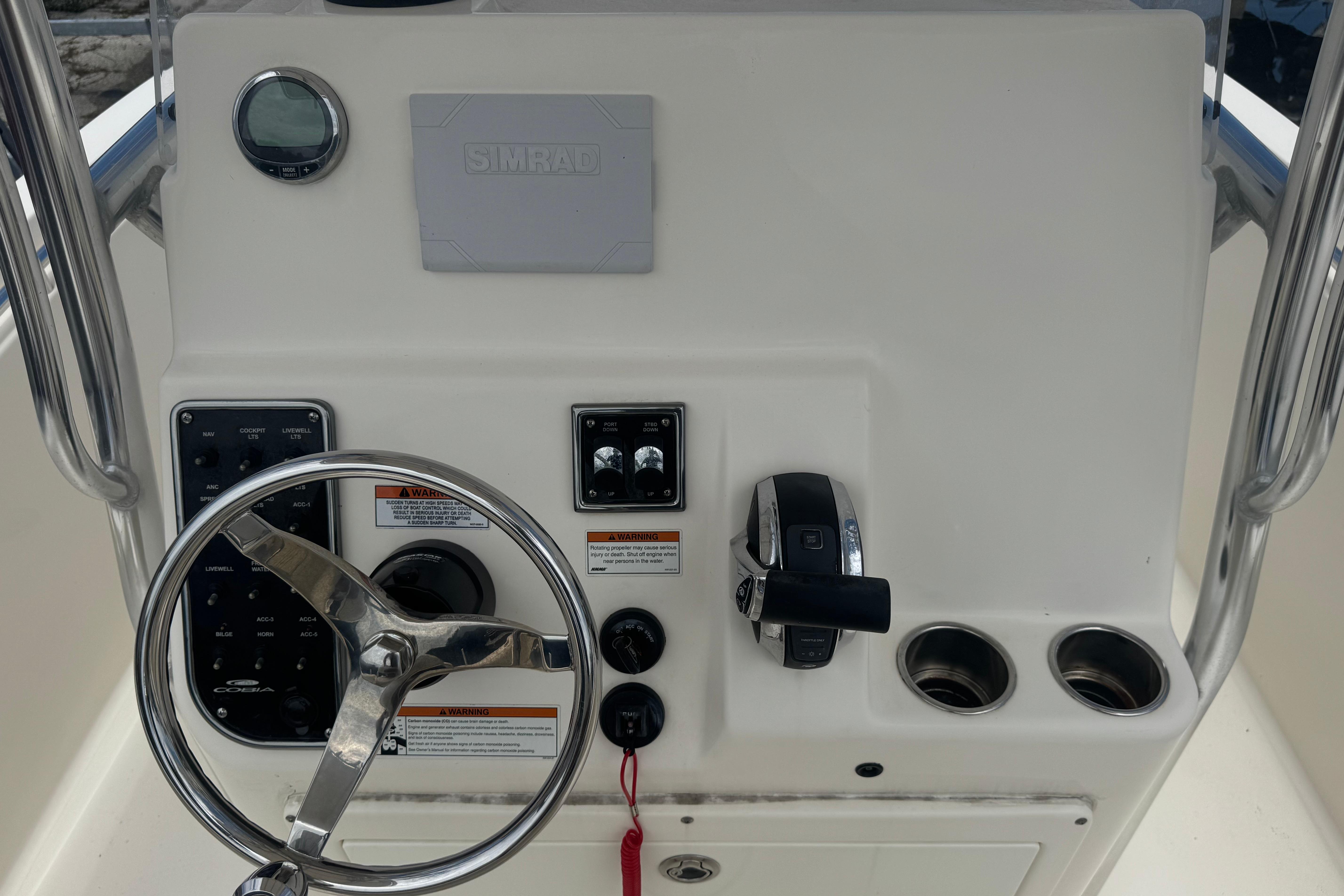2022 Cobia 237 Center Console dashboard with steering wheel and controls.