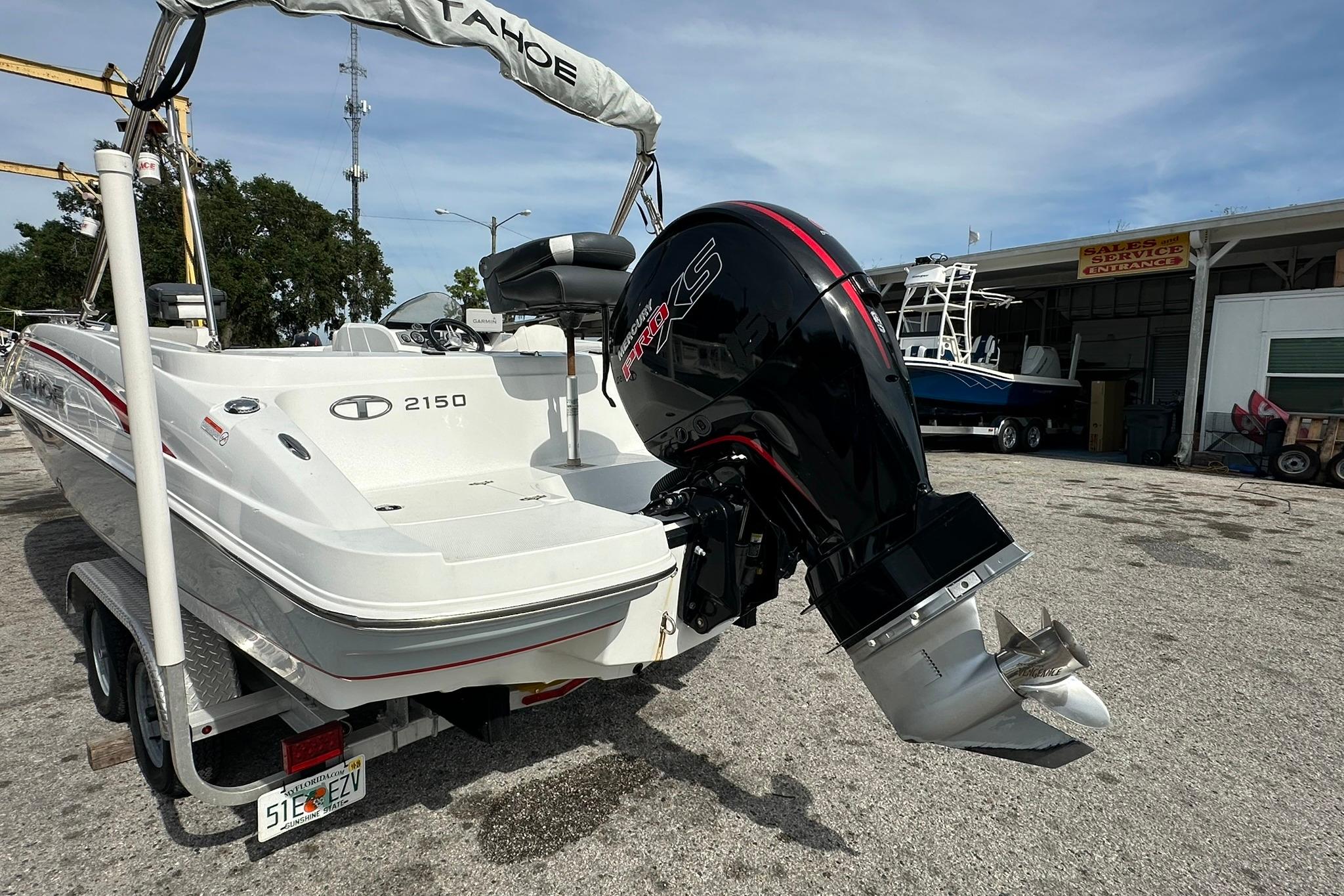 2021 Tahoe 2150 boat with powerful outboard motor on trailer.