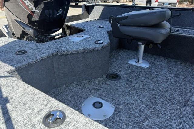 2026 Tracker Pro Guide V-16 SC boat interior with seating and motor.