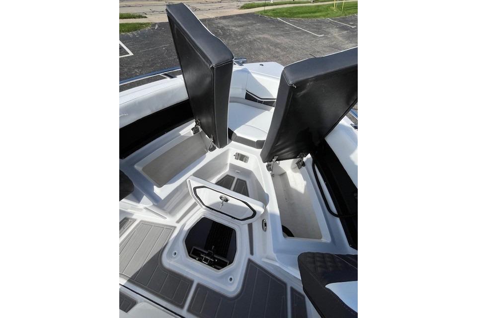2026 Monterey Elite 27 SD boat interior with seating and storage compartments.