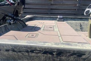 2026 Tracker Grizzly 2072 CC boat with camouflage design and spacious deck layout.