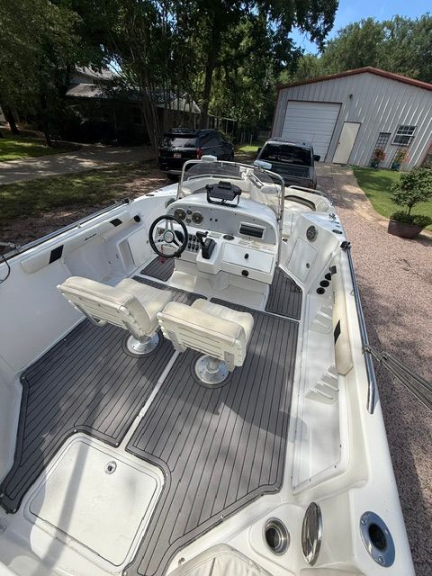 The image shows the cockpit of a 2016 Hurricane SunDeck Sport 231 OB with two seats.