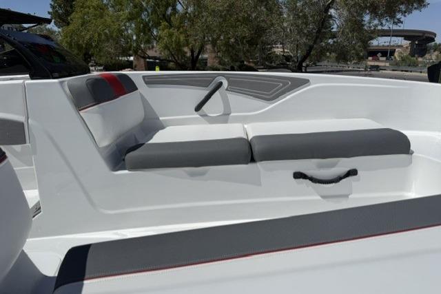 2026 Tahoe T21 boat interior with gray and white seating, outdoor setting.