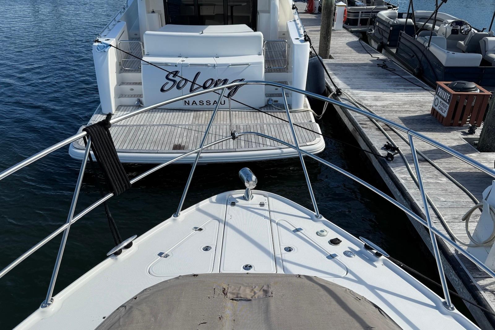 2003 Regal Commodore 3880 yacht docked at marina, view from bow.