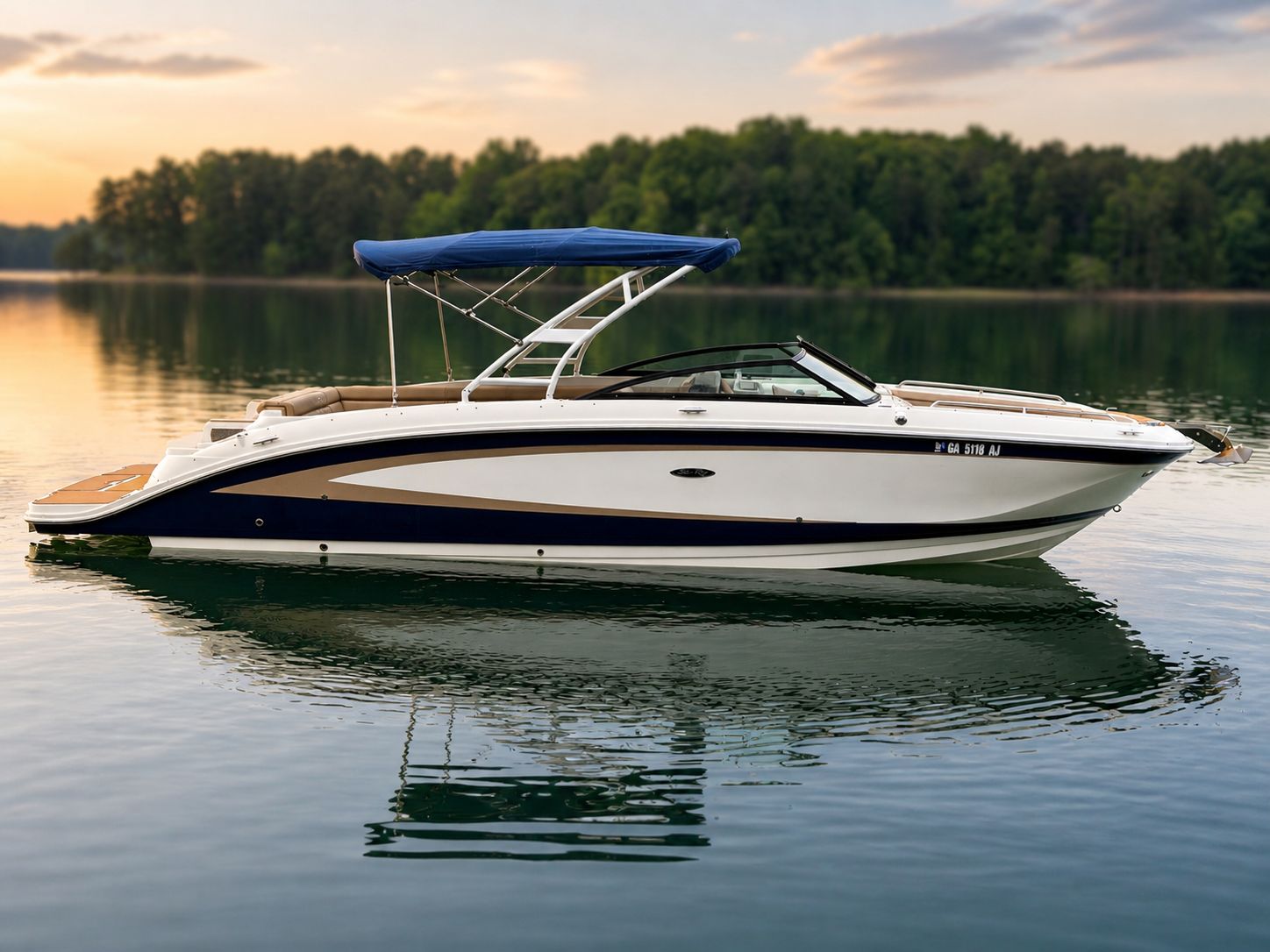2016 Sea Ray 290 Sundeck boat on calm water at sunset.