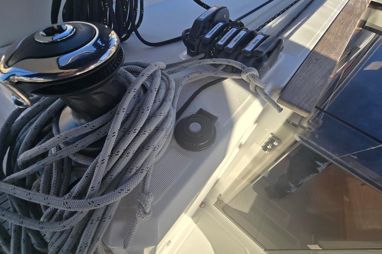 Deck of 2023 Beneteau Oceanis 38.1 with winch and ropes.