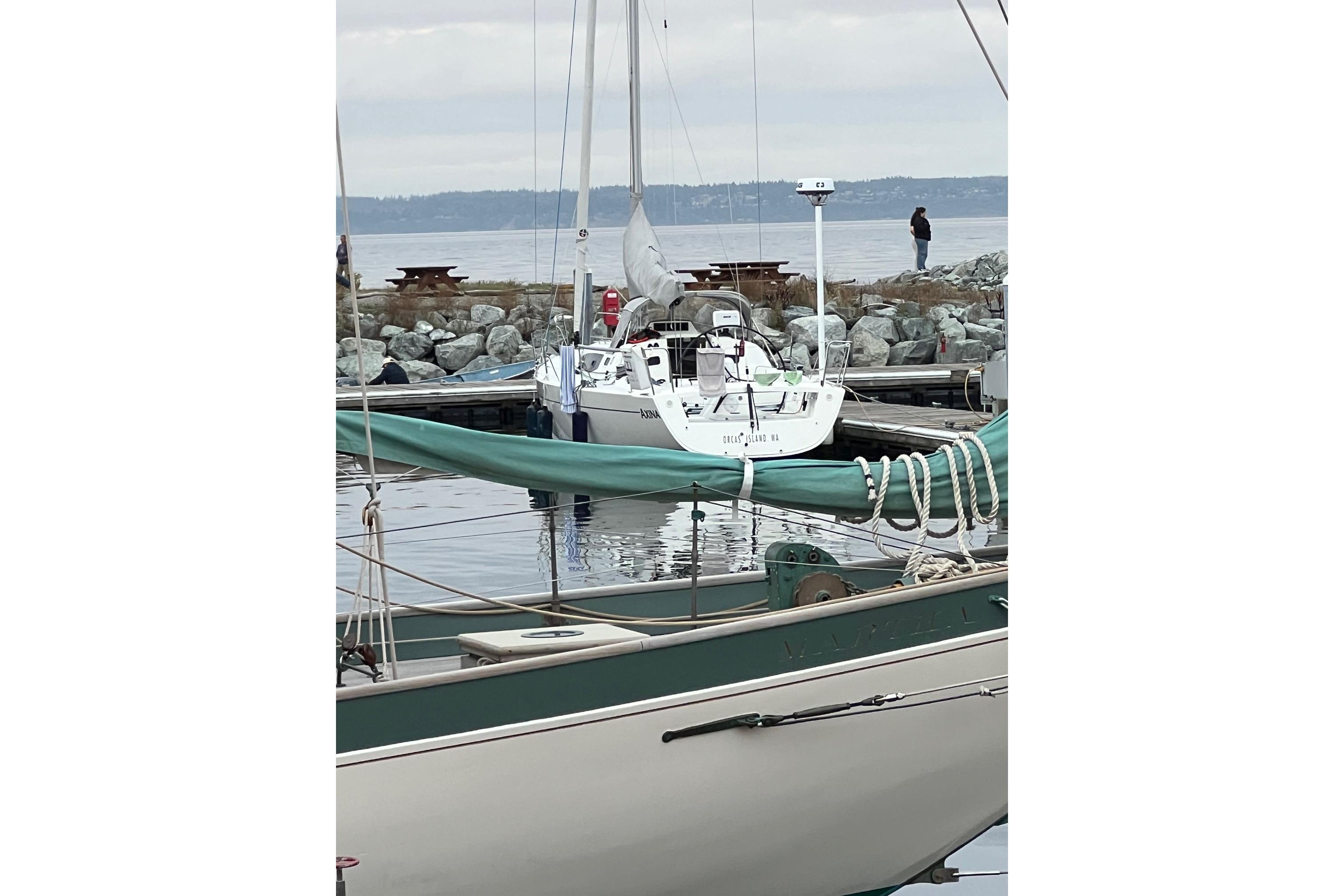 2021 J Boats J/112E sailboat docked at a marina with calm waters.