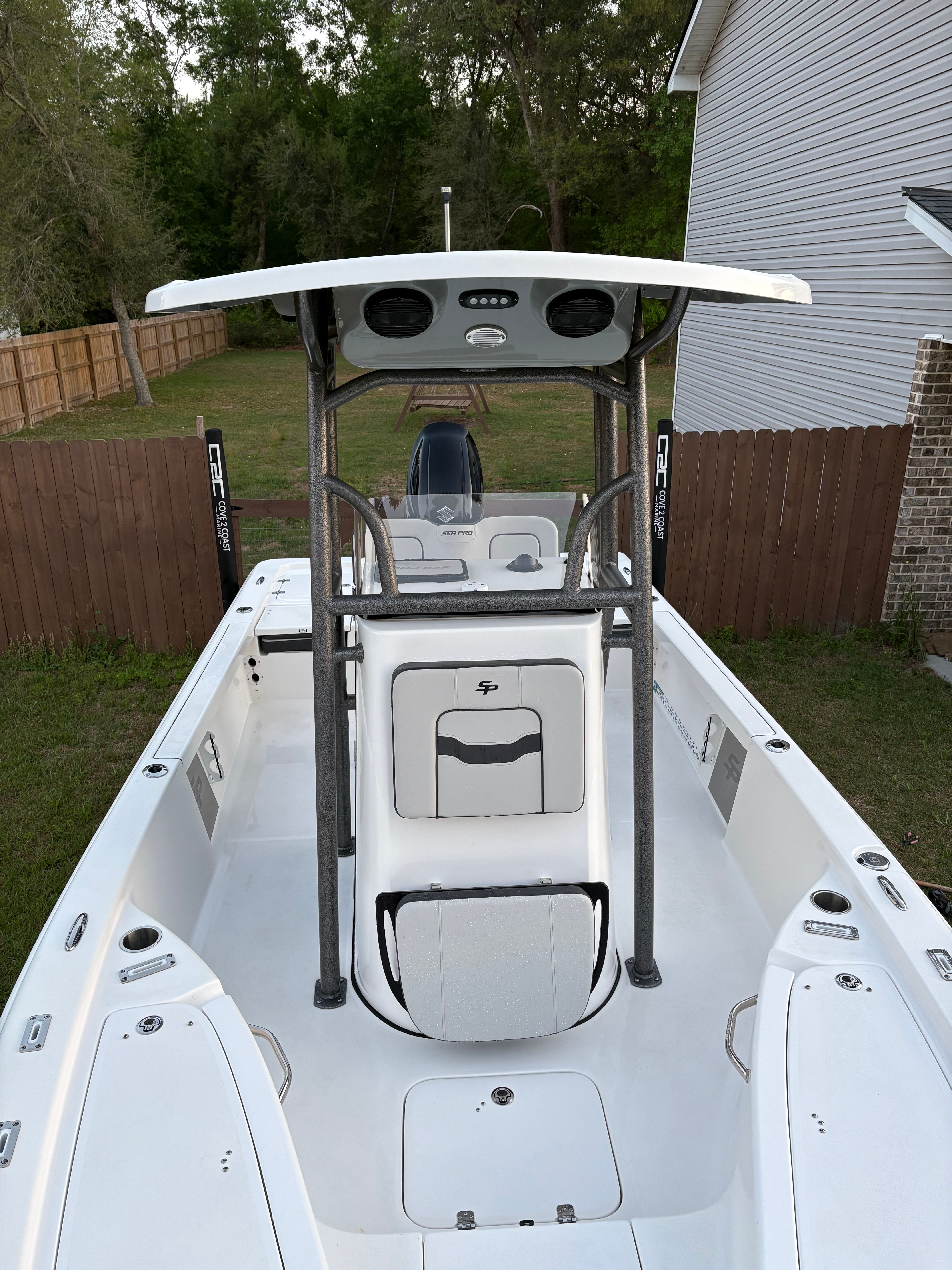 2025 Sea Pro 230 Bay boat parked in backyard.