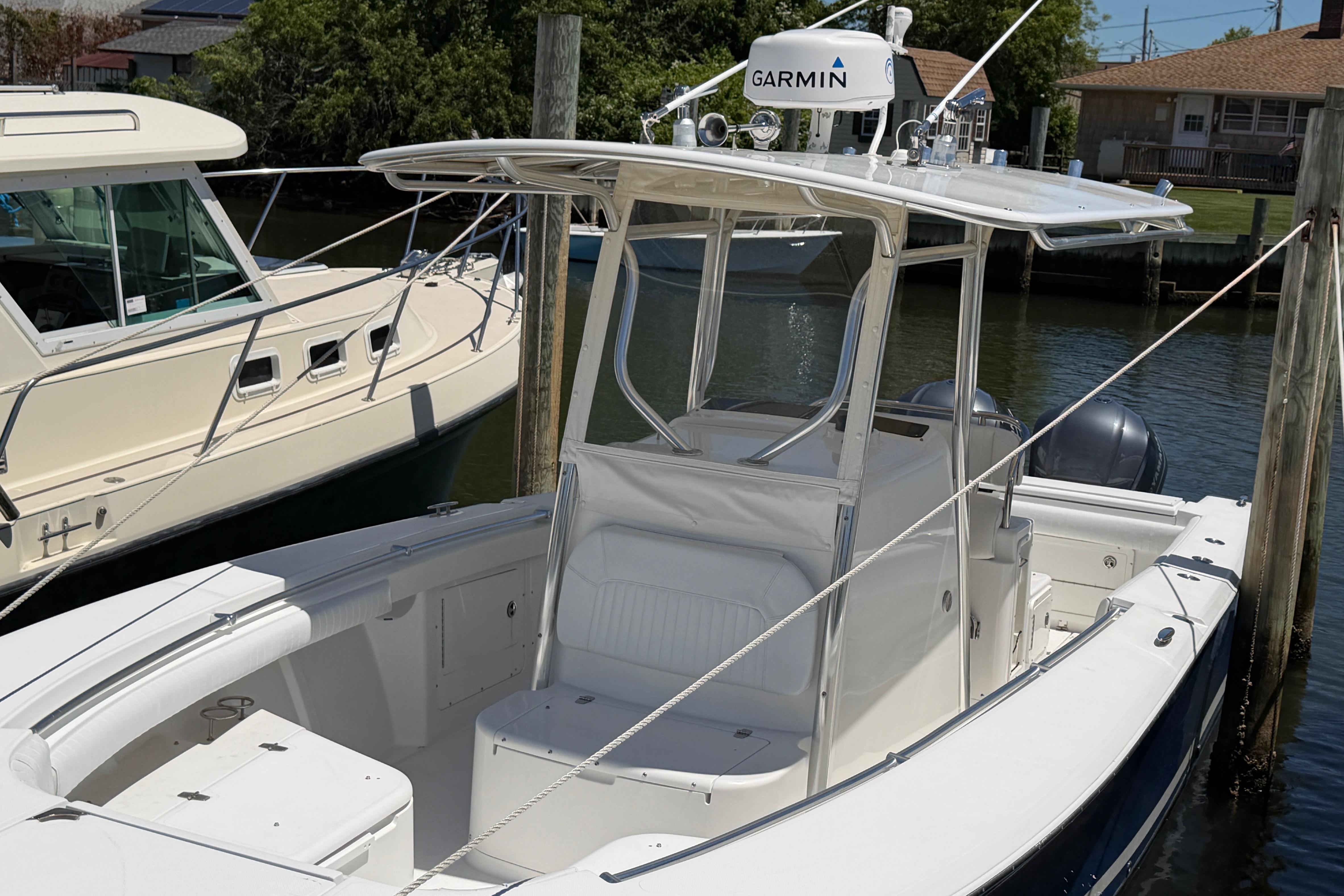 2006 Southport 26 Center Console boat docked with Garmin equipment visible.