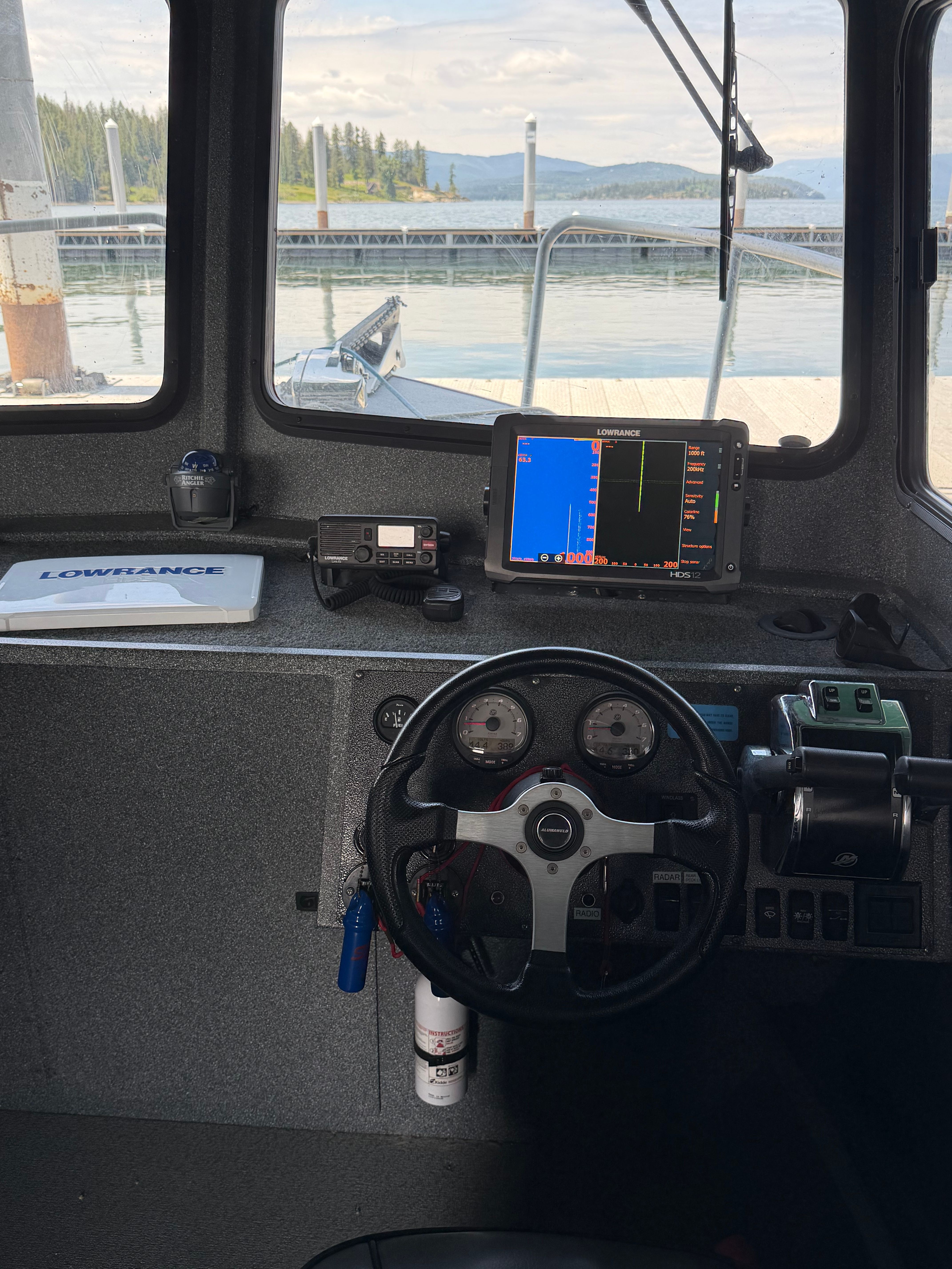 Interior view of a 2013 Alumaweld Pacific 27 boat with steering console.
