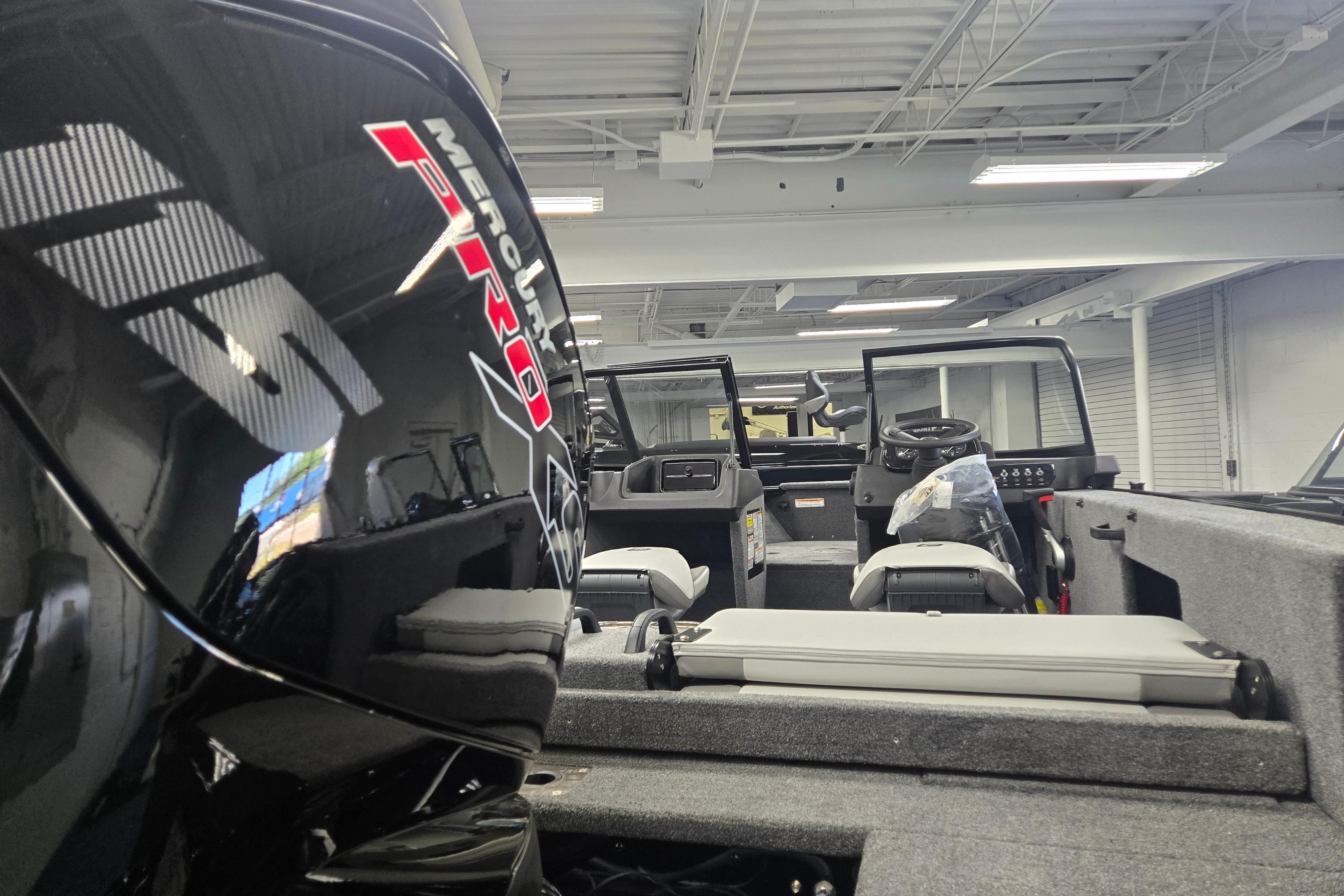 2026 Princecraft Sport 175 MAX boat interior with Mercury Pro engine in showroom.
