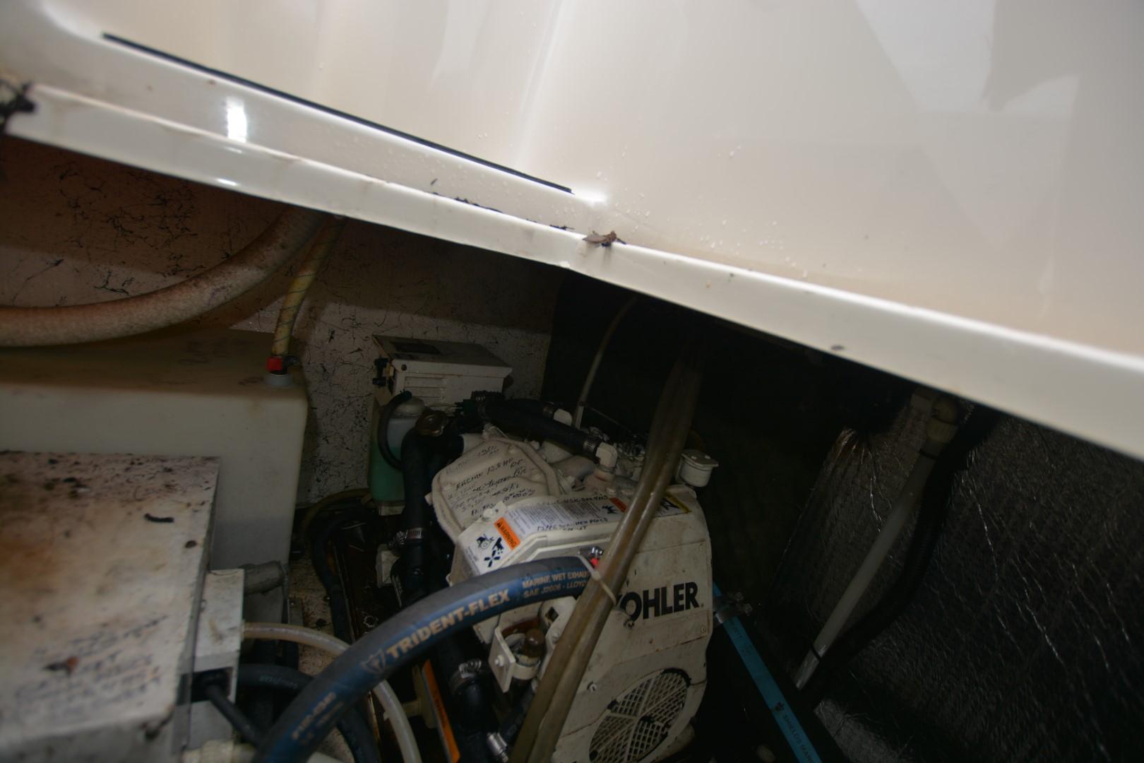 Engine compartment of 1999 Rinker 270 Fiesta Vee with Kohler generator.