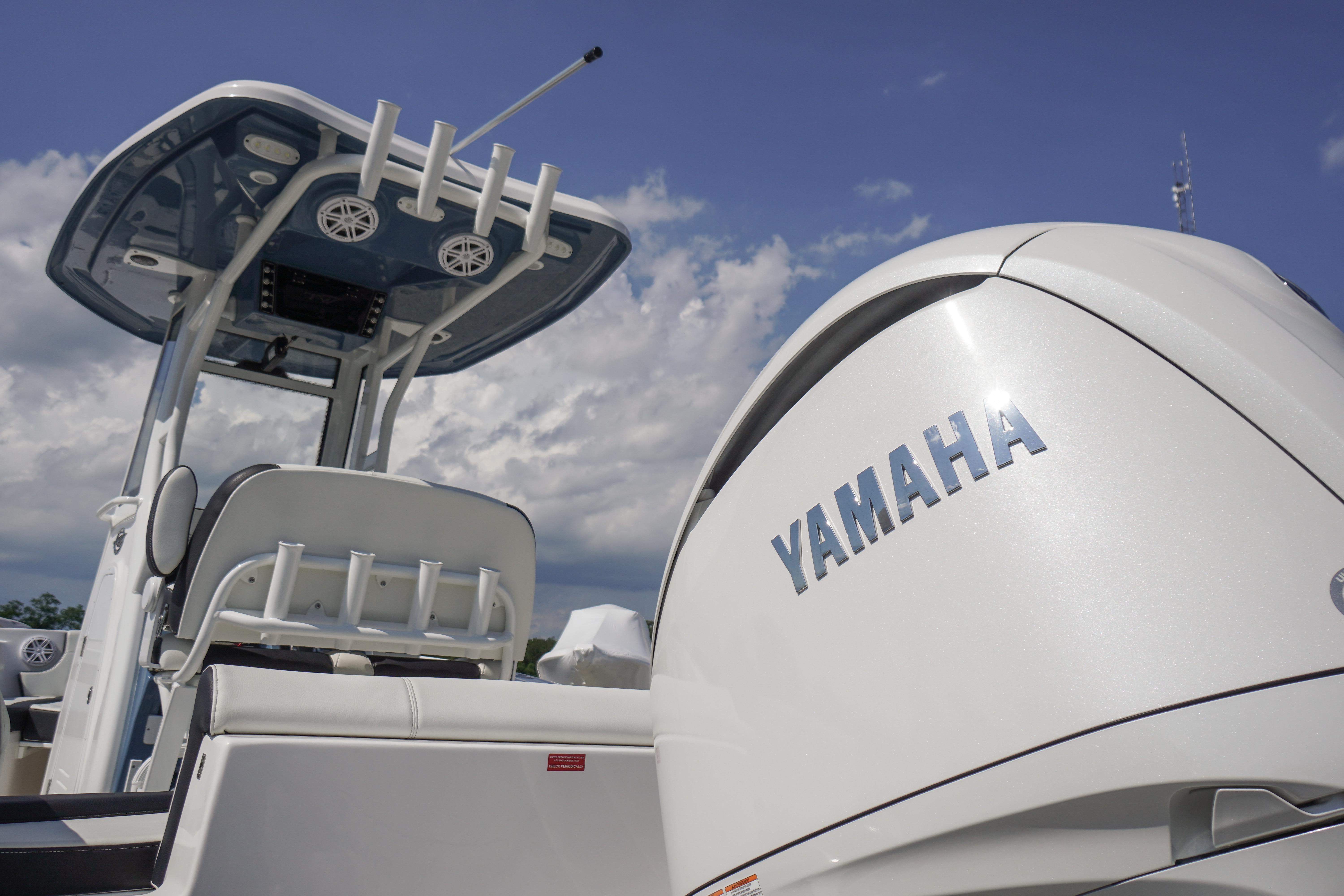 2025 Tidewater 232 SS boat with Yamaha engine under a clear sky.