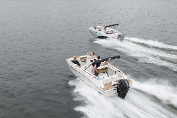 Two Starcraft SVX 211 OB CC boats cruising on open water, 2025 model.