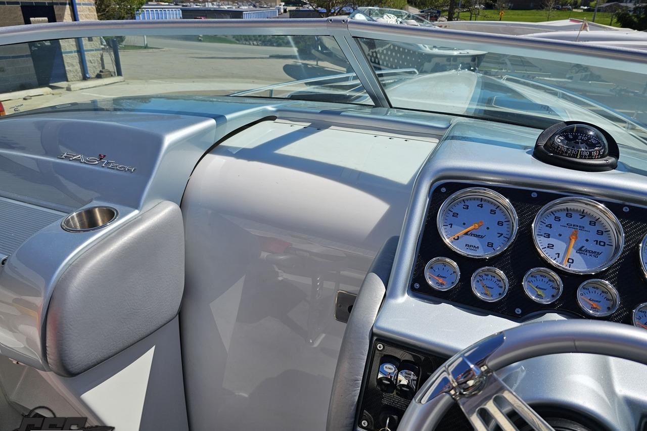 2014 Formula 292 FASTech dashboard with gauges and steering wheel in a sleek design.