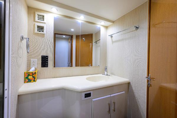 Bathroom interior of 2000 Viking 50 Convertible yacht, featuring modern fixtures and ample lighting.