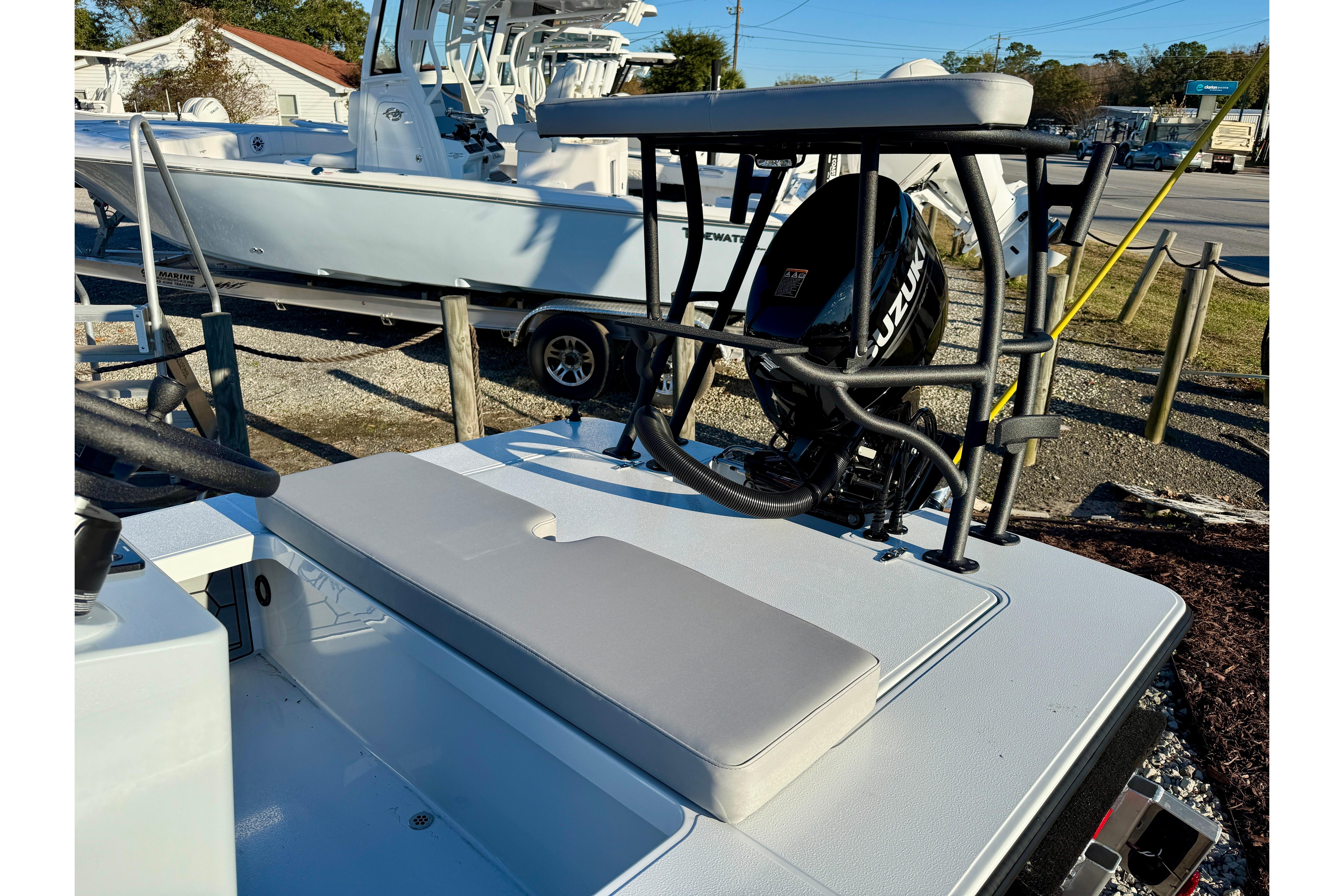 2026 East Cape EVO 17V boat with Suzuki outboard motor, parked outdoors.