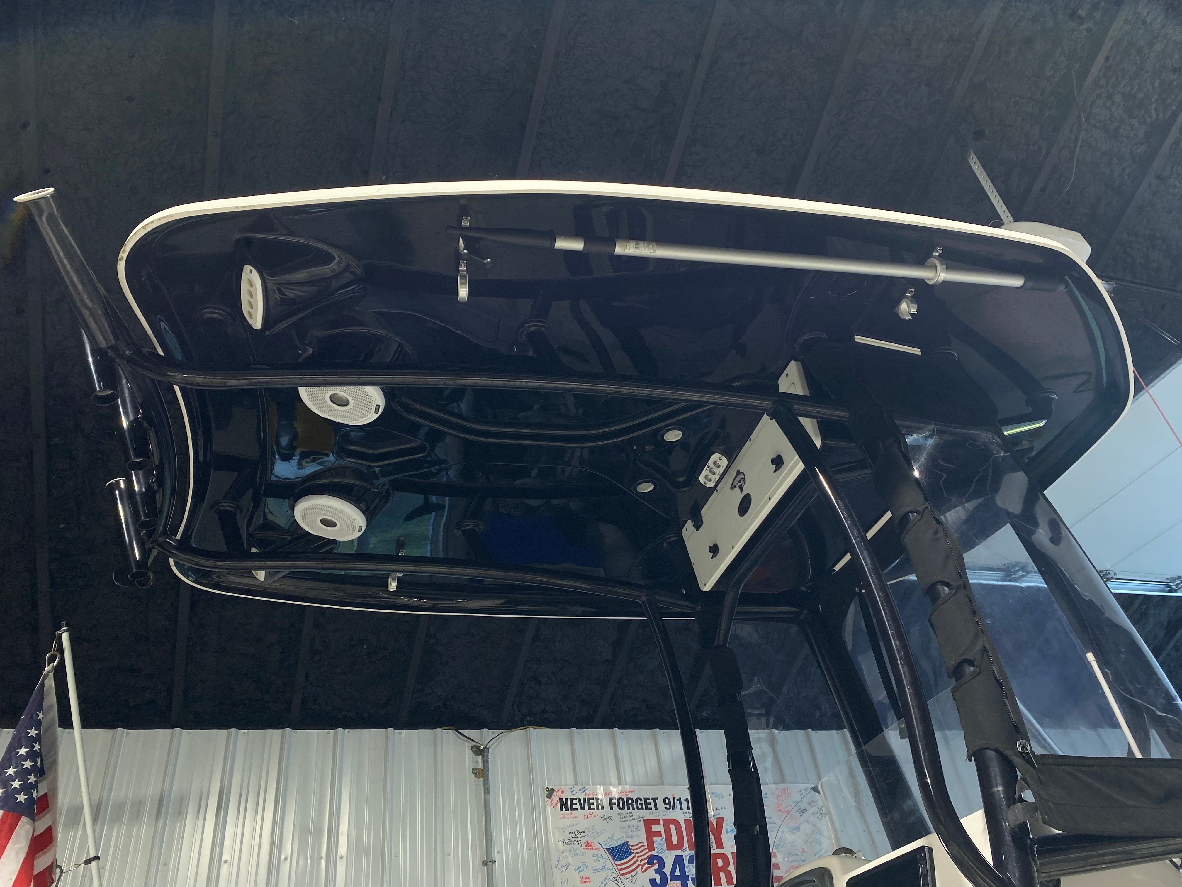 Tidewater 220 CC Adventure 2015 boat roof view in a warehouse.