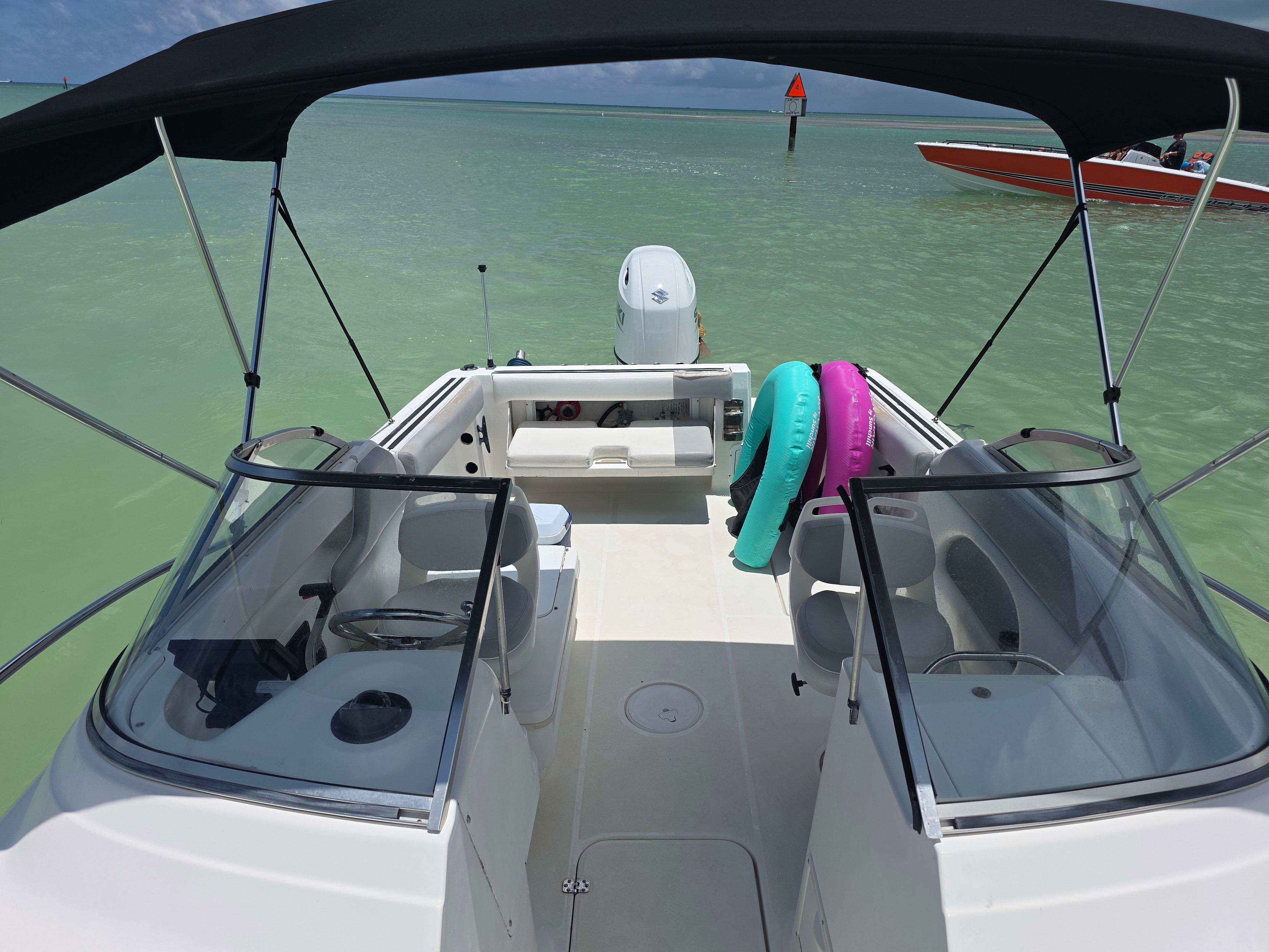 Wellcraft Sportsman 2001 boat on calm water with swim rings.