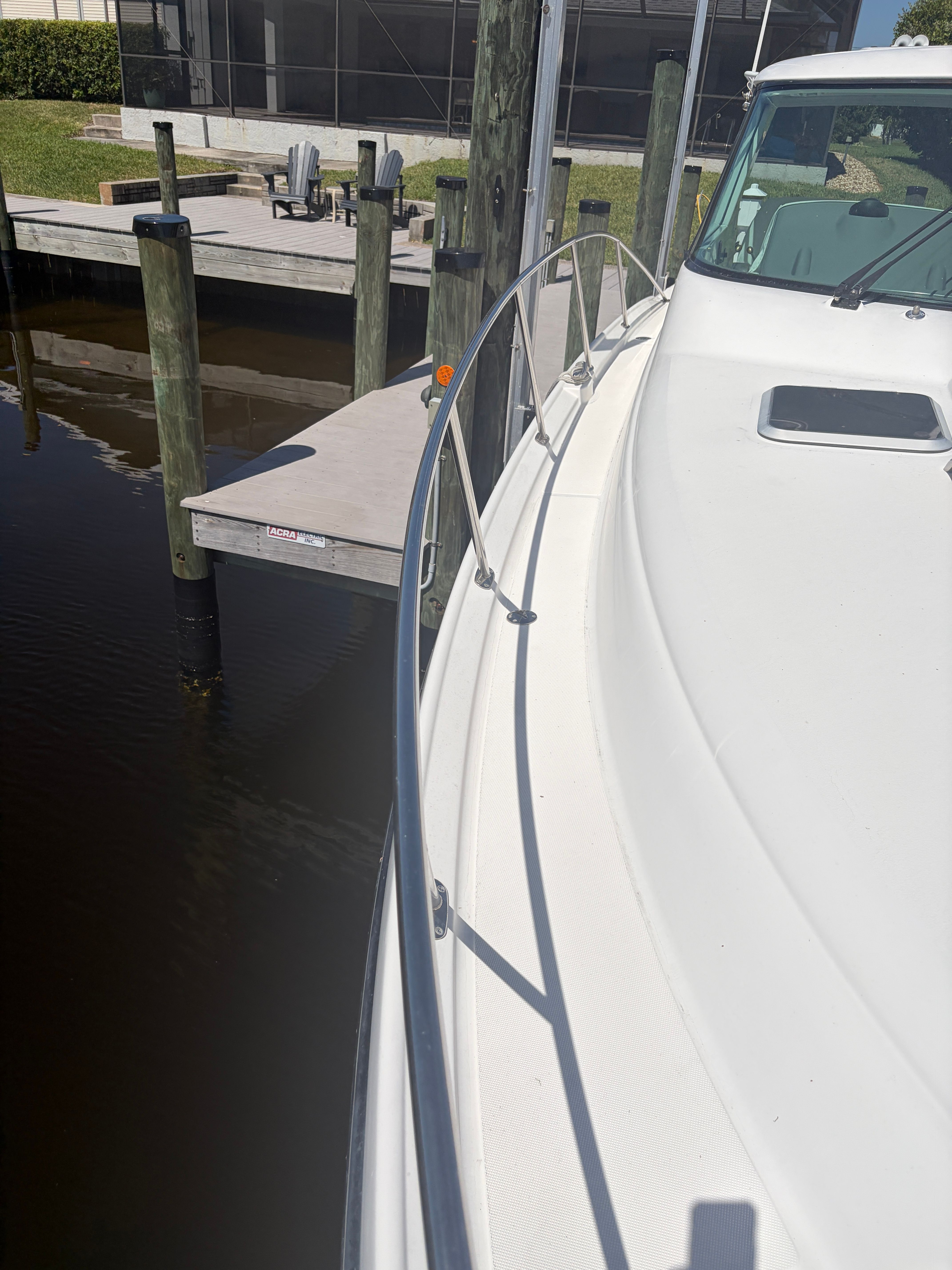 2005 Tiara Yachts Sovran at dock, side view.