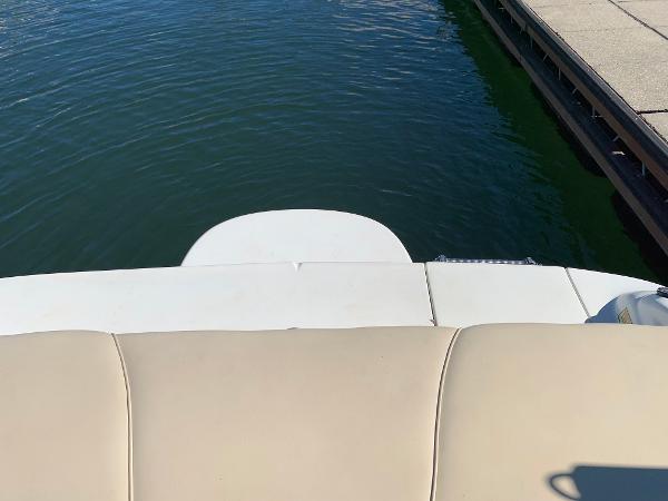 Sea Ray 210 Bow Rider 2000 boat stern view at dock.