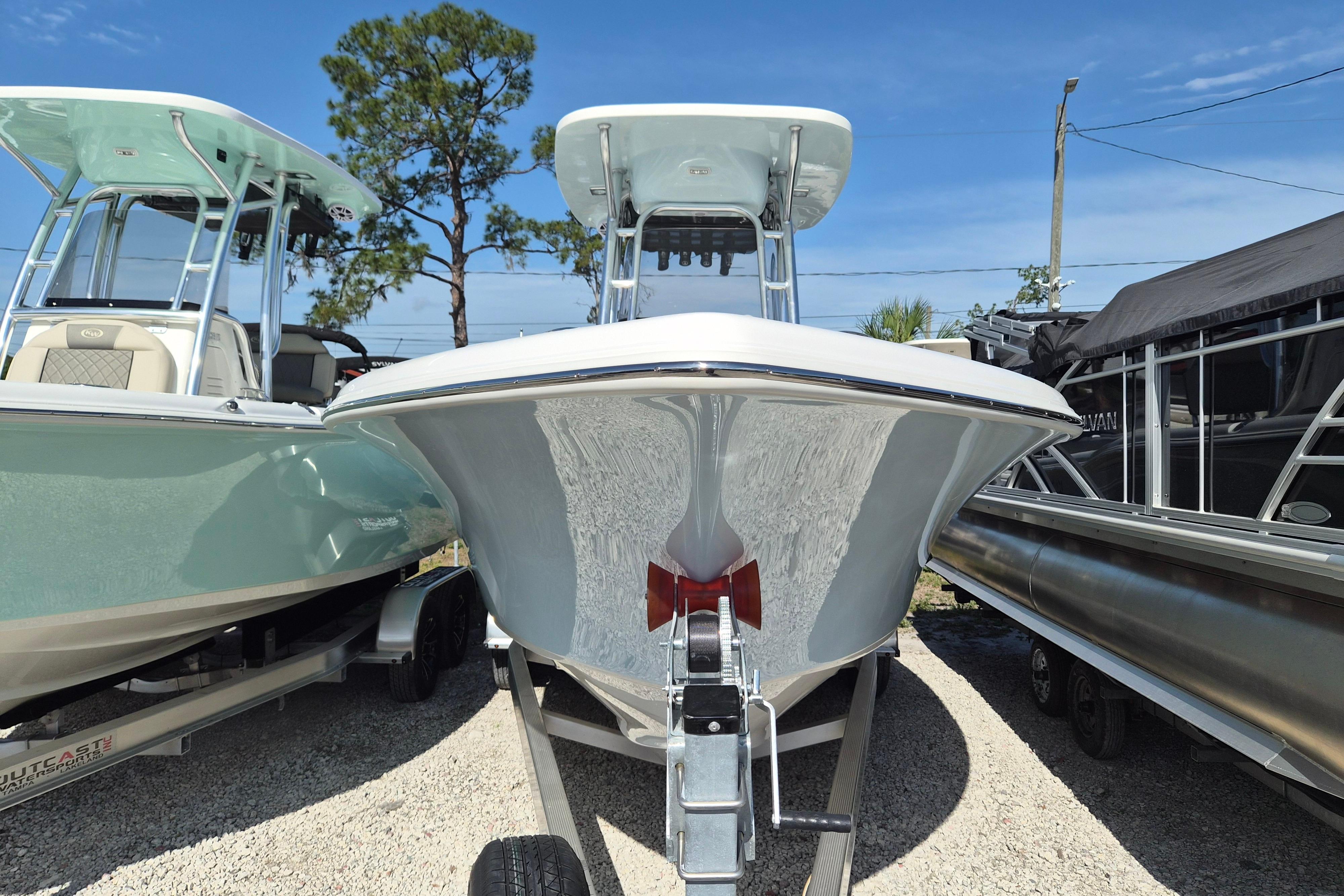 2026 Key West 239 FS boat on trailer, parked outdoors under clear sky.