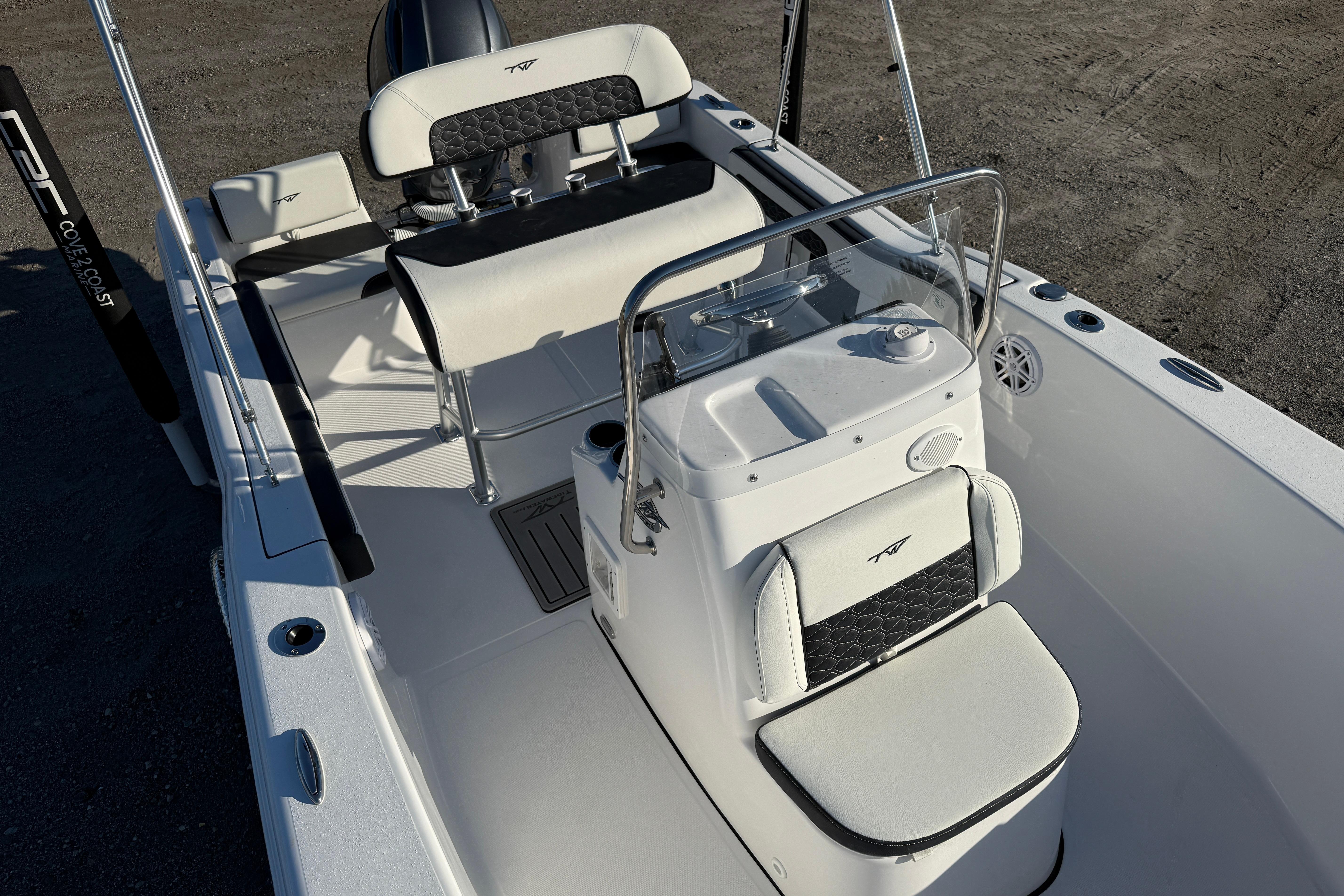 2026 Tidewater 180 CC Adventure boat interior with seating and console, featuring sleek design elements.