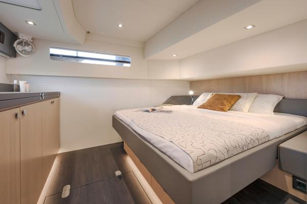 Luxurious bedroom interior of 2025 Privilege Signature 650 yacht with modern design.