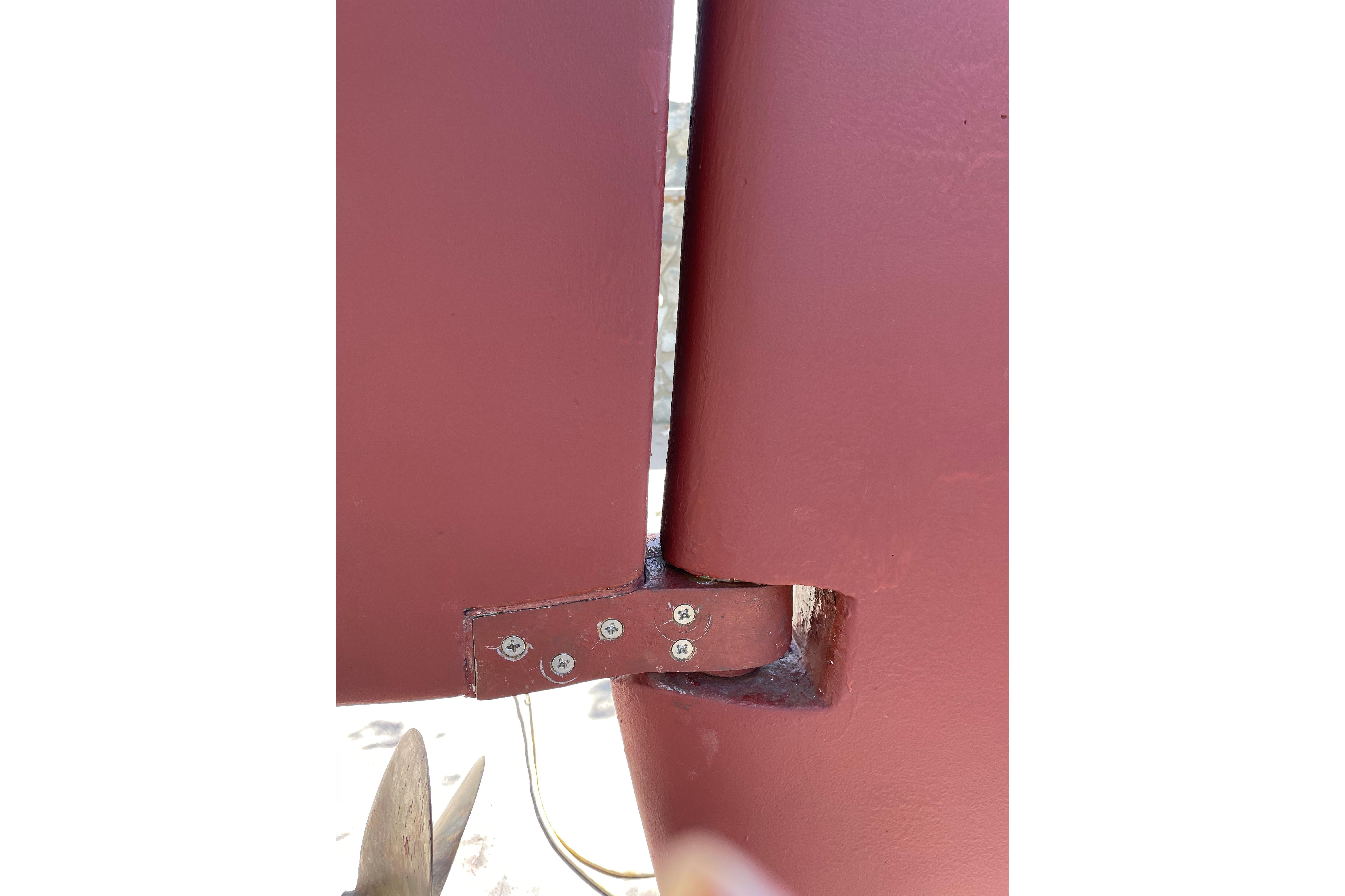 Close-up of 1982 Endeavour 37 rudder and propeller detail.