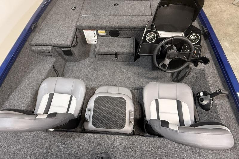 2026 Lowe Stinger 175C boat interior with three seats and steering console.