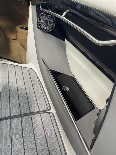 Interior view of a 2005 Cobalt 343 boat, featuring sleek design and speaker system.
