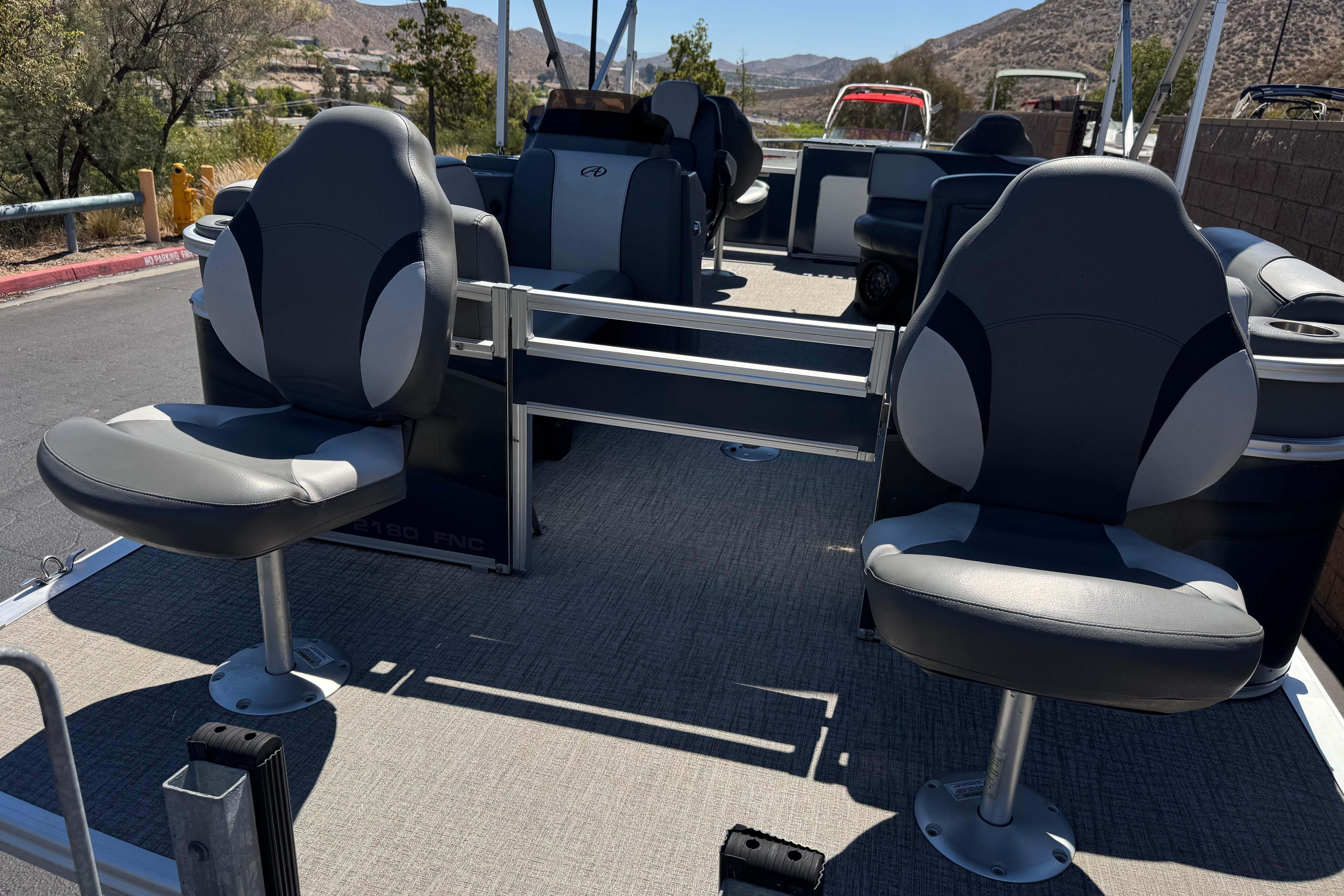 2023 Avalon Venture Fish N Cruise 20' pontoon boat with comfortable seating and spacious deck.