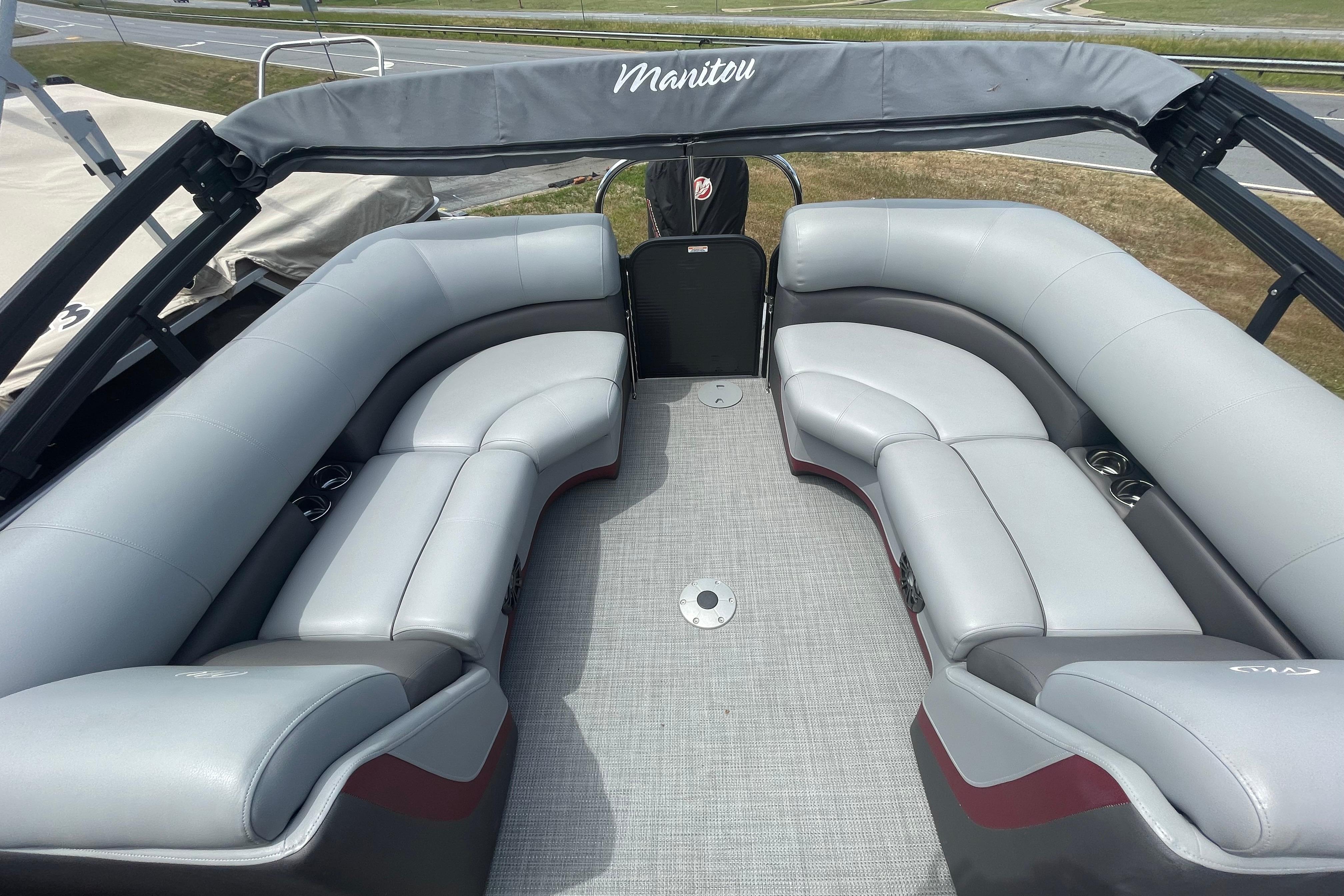 2022 Manitou 23 Oasis pontoon boat with spacious seating and modern design.
