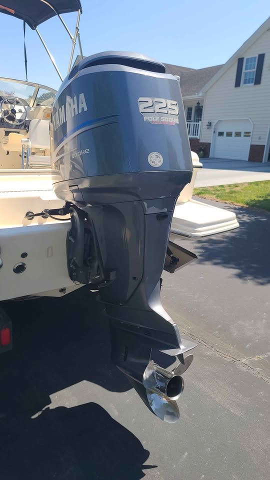 A Yamaha outboard motor is attached to a Scout 222 Dorado boat, which is on a trailer.