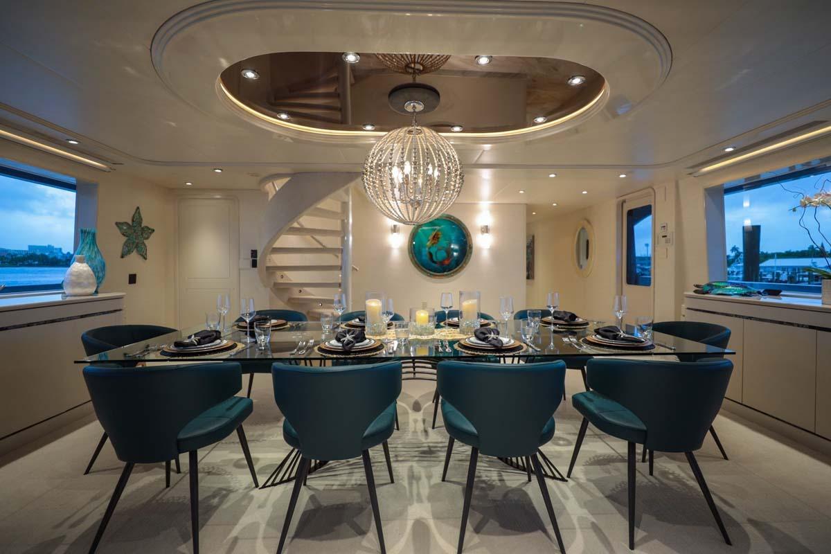 Luxurious dining area on 2001 Westship Skylounge yacht, featuring elegant decor and ambient lighting.