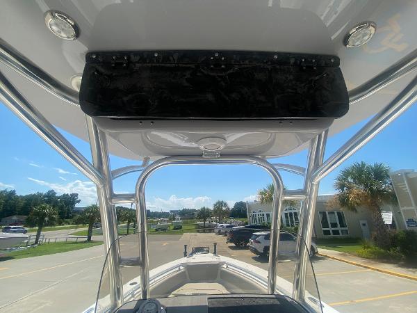 2024 Key West 239 FS boat interior view with T-top and console.