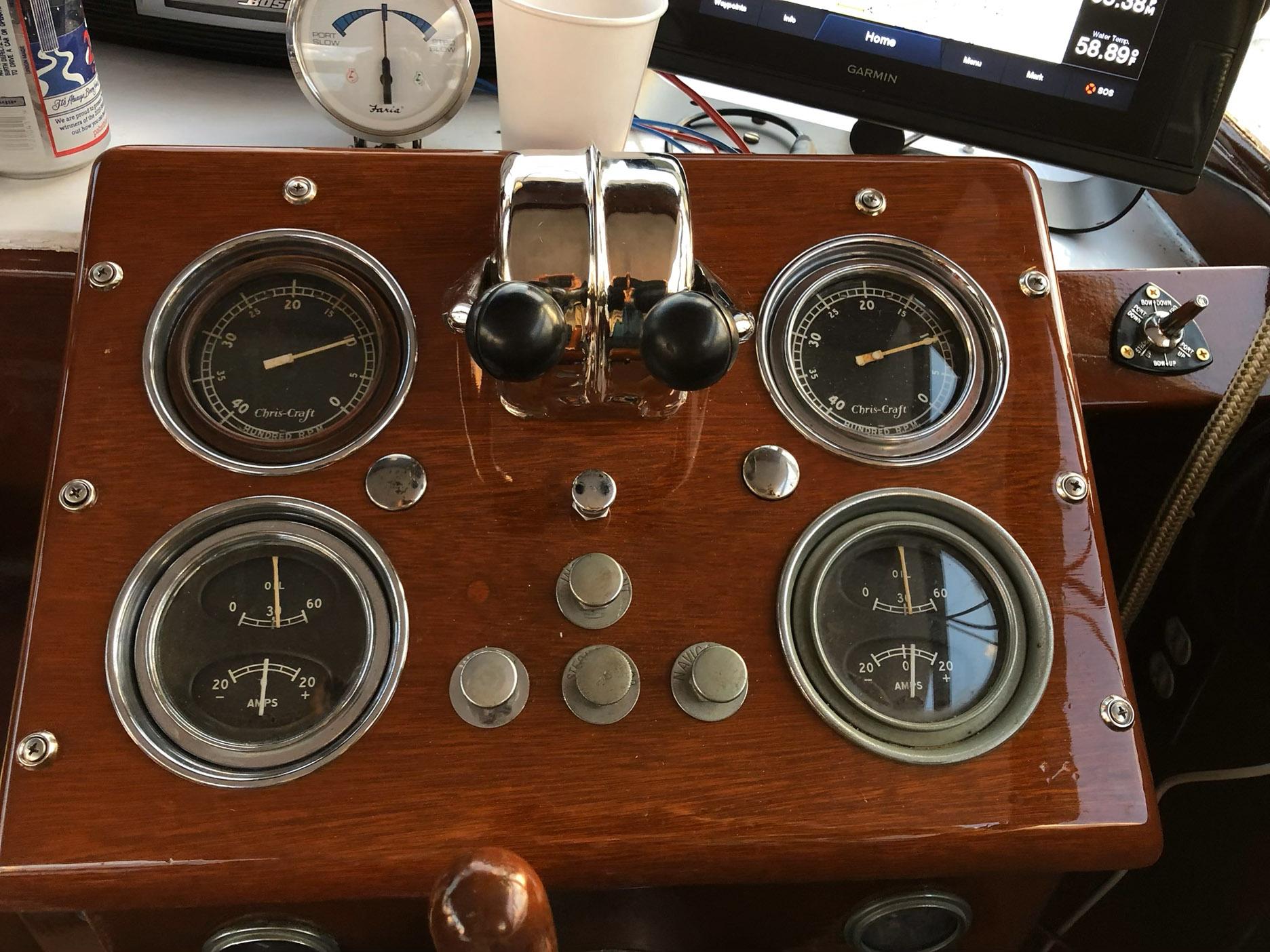 1956 Chris-Craft Captain dashboard with vintage gauges and controls.