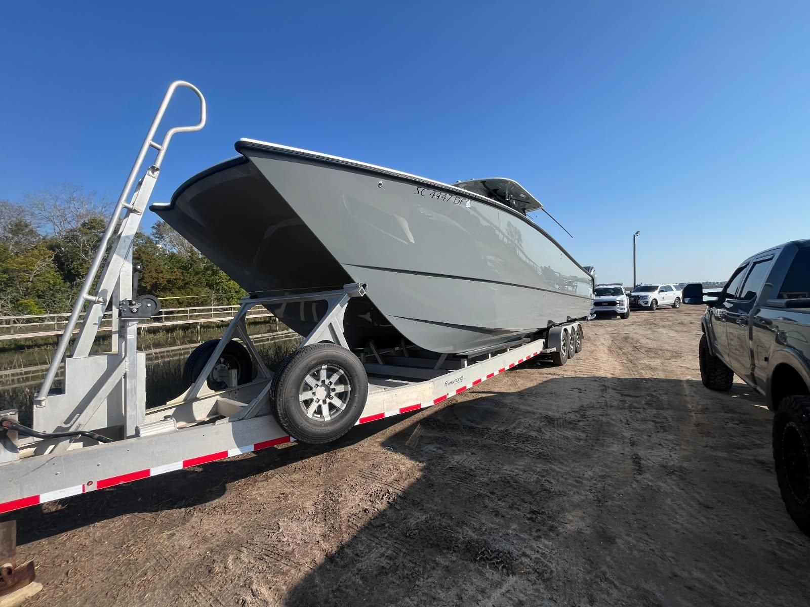 2017 Freeman 37VH boat on trailer in sunny weather.