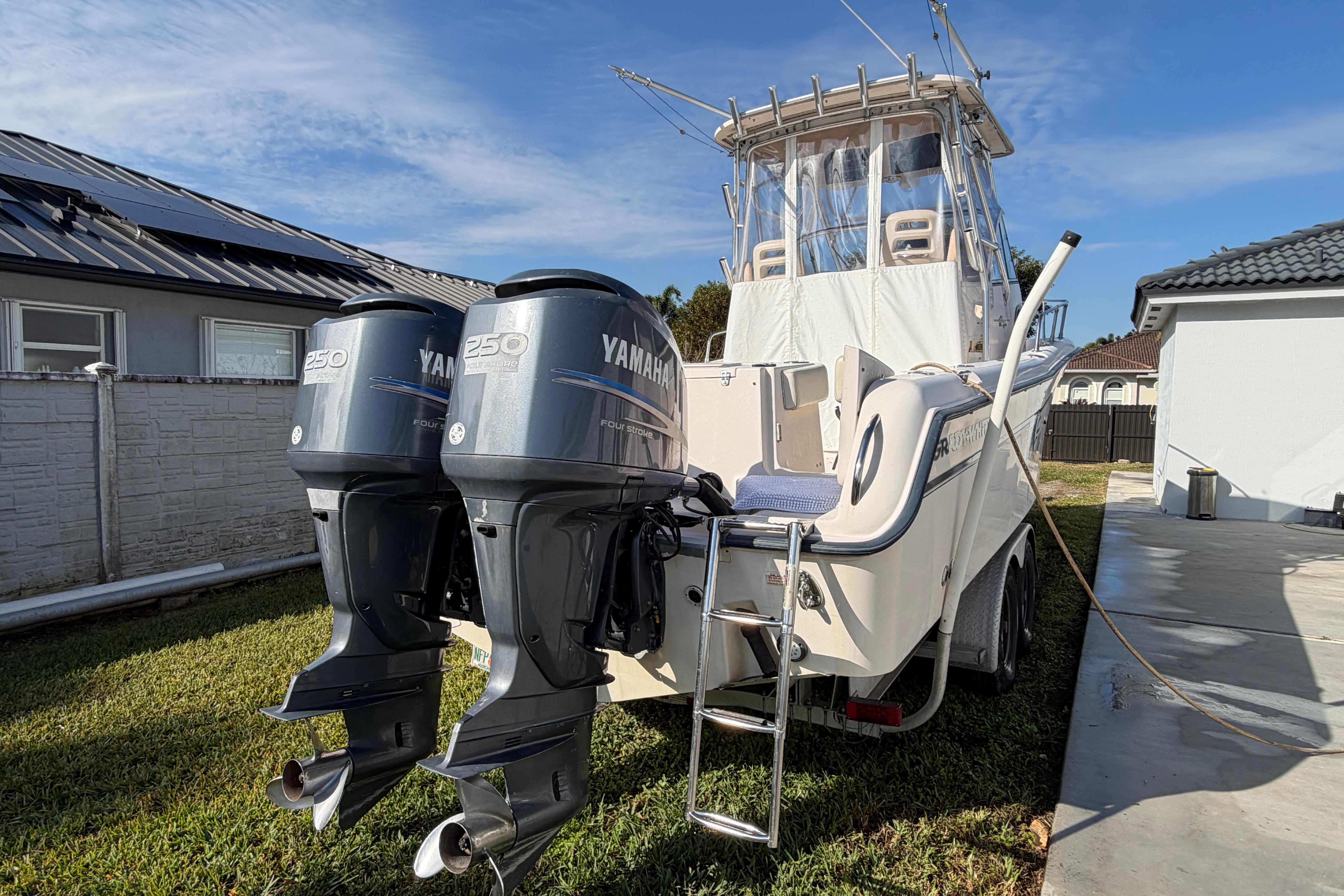 2006 Grady-White Sailfish 282 boat with twin Yamaha 250 engines, parked outdoors.