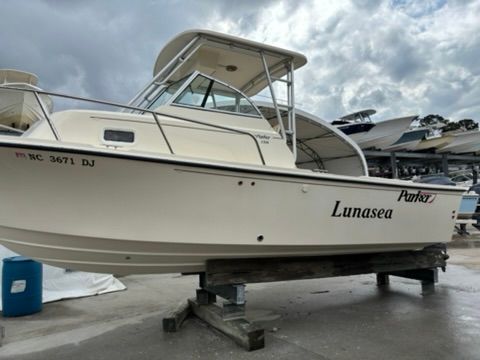 A 2008 Parker 2310 Walkaround boat is on a stand on land.