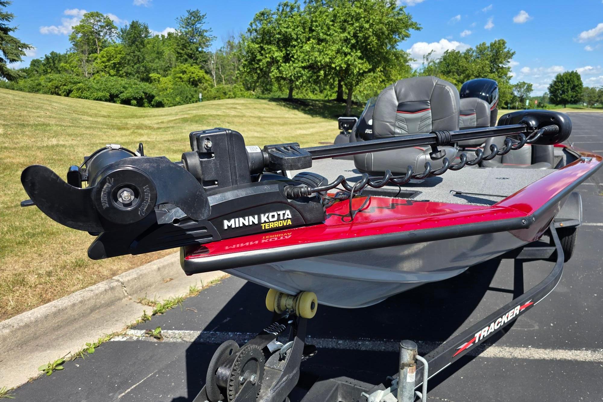 2021 Tracker Pro Team 175 TXW boat with Minn Kota Terrova motor, parked outdoors.